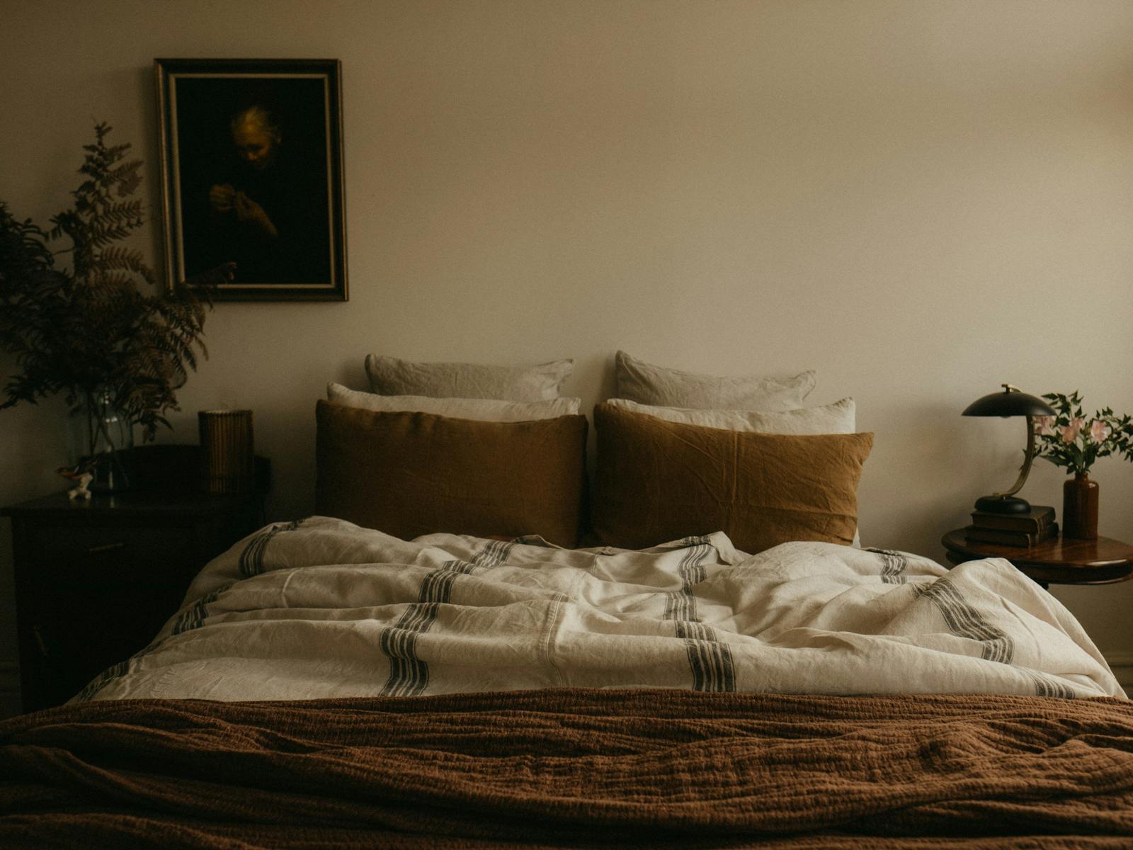 French linens layered on a queen bed