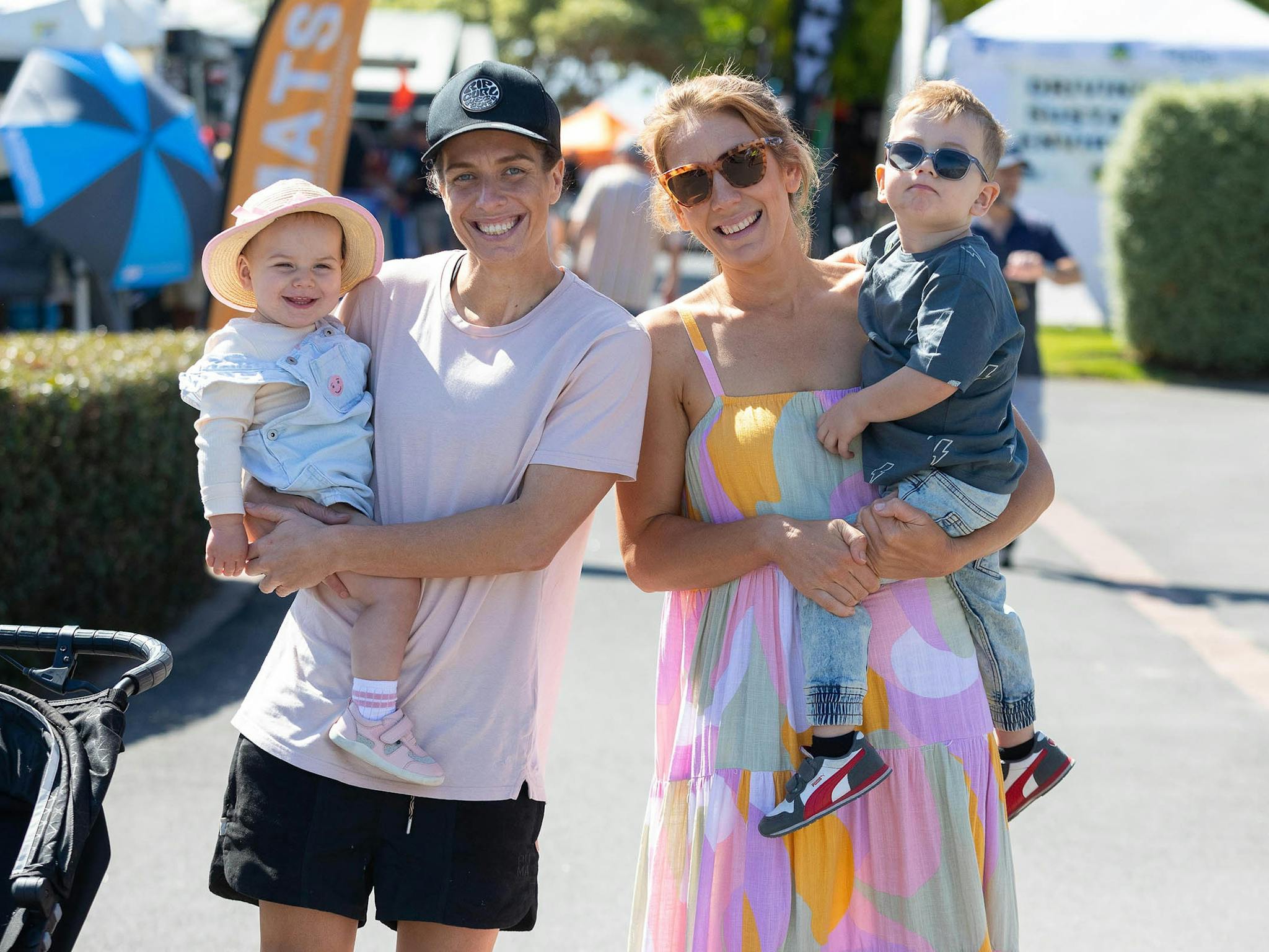 A family of four with big smiles enjoying the Outdoor Living & Caravan Expo