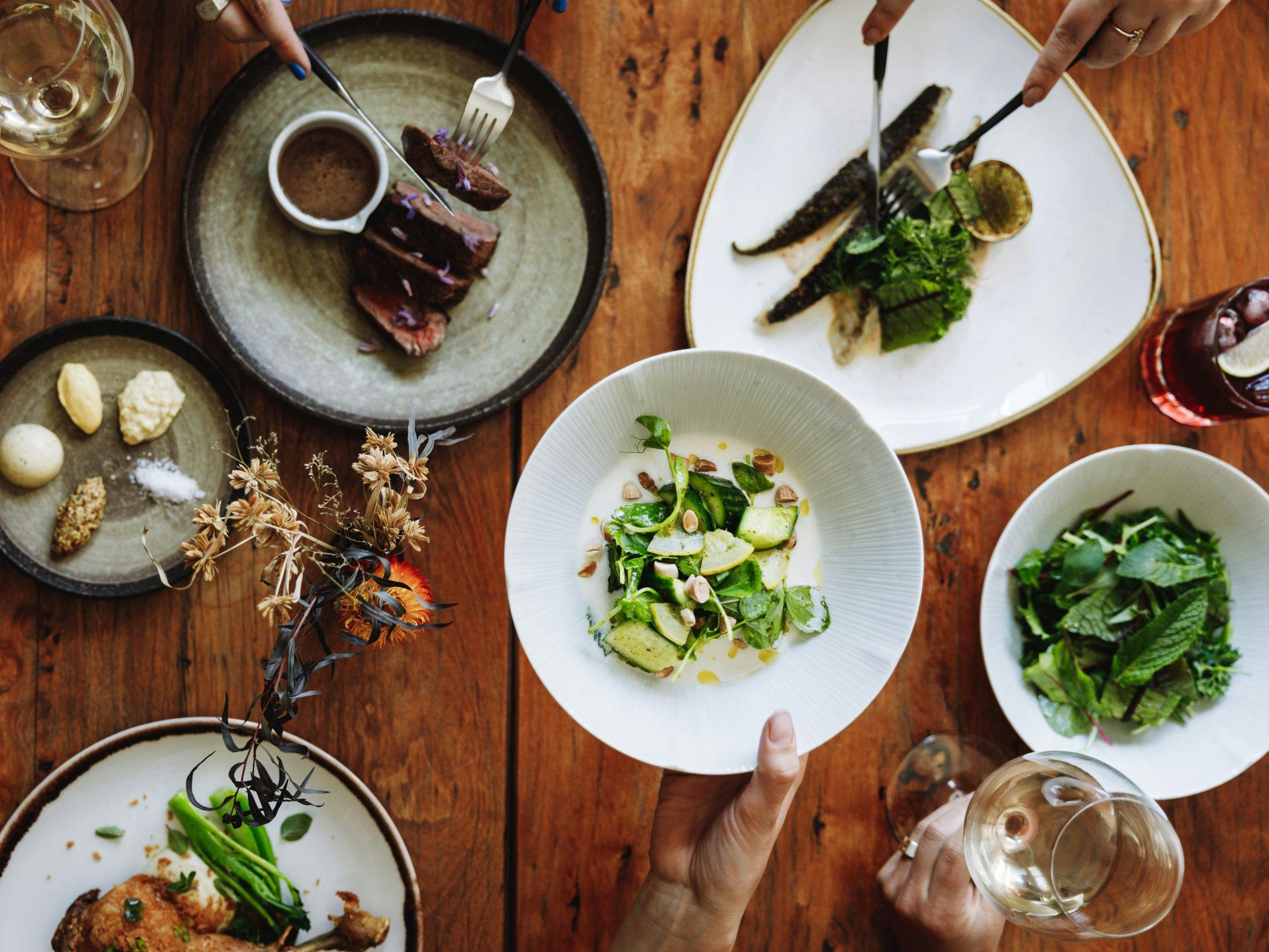 An image of food spread out on the table at Elm Dining