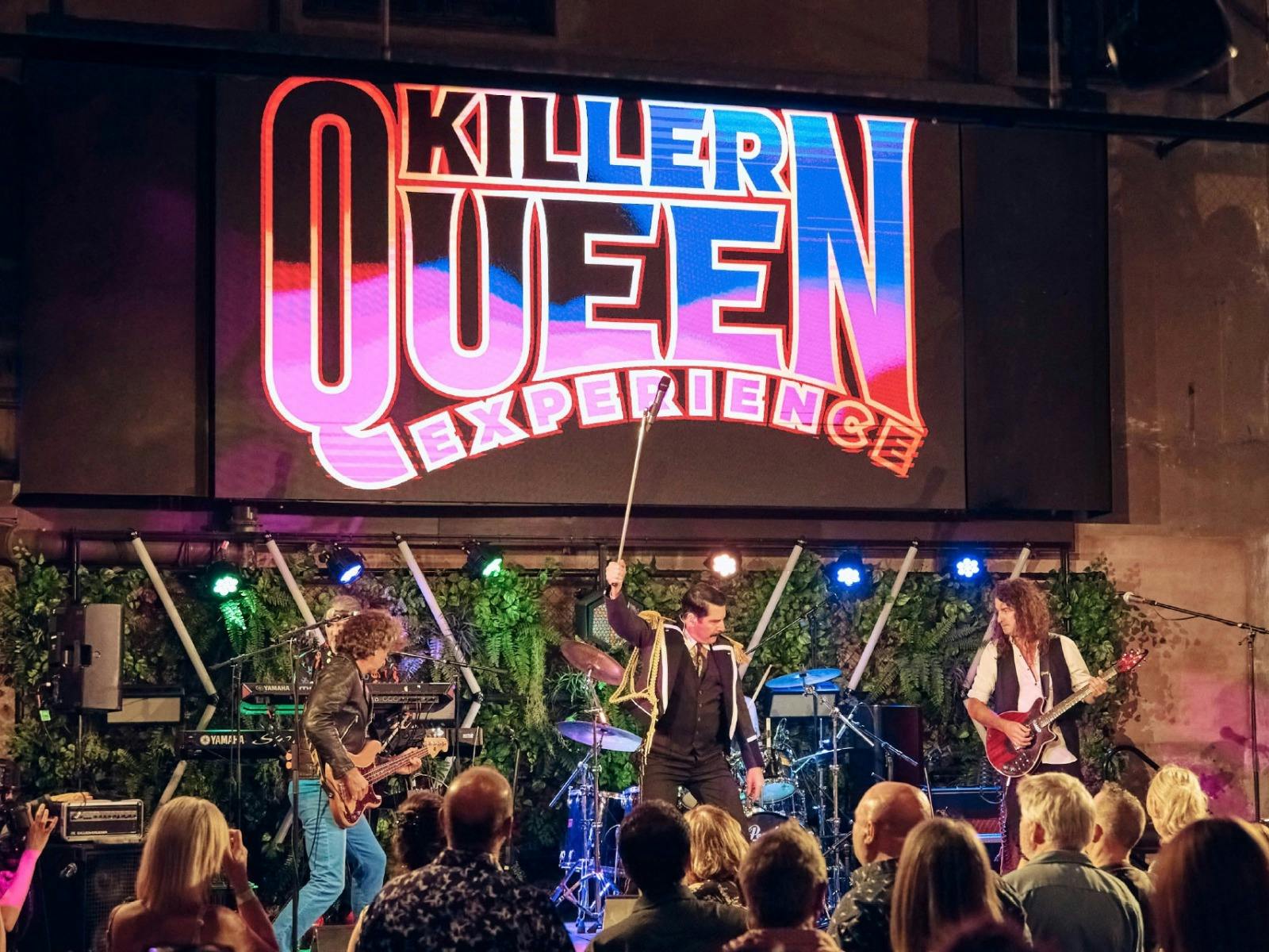 Killer Queen Experience performing live on stage at The District.