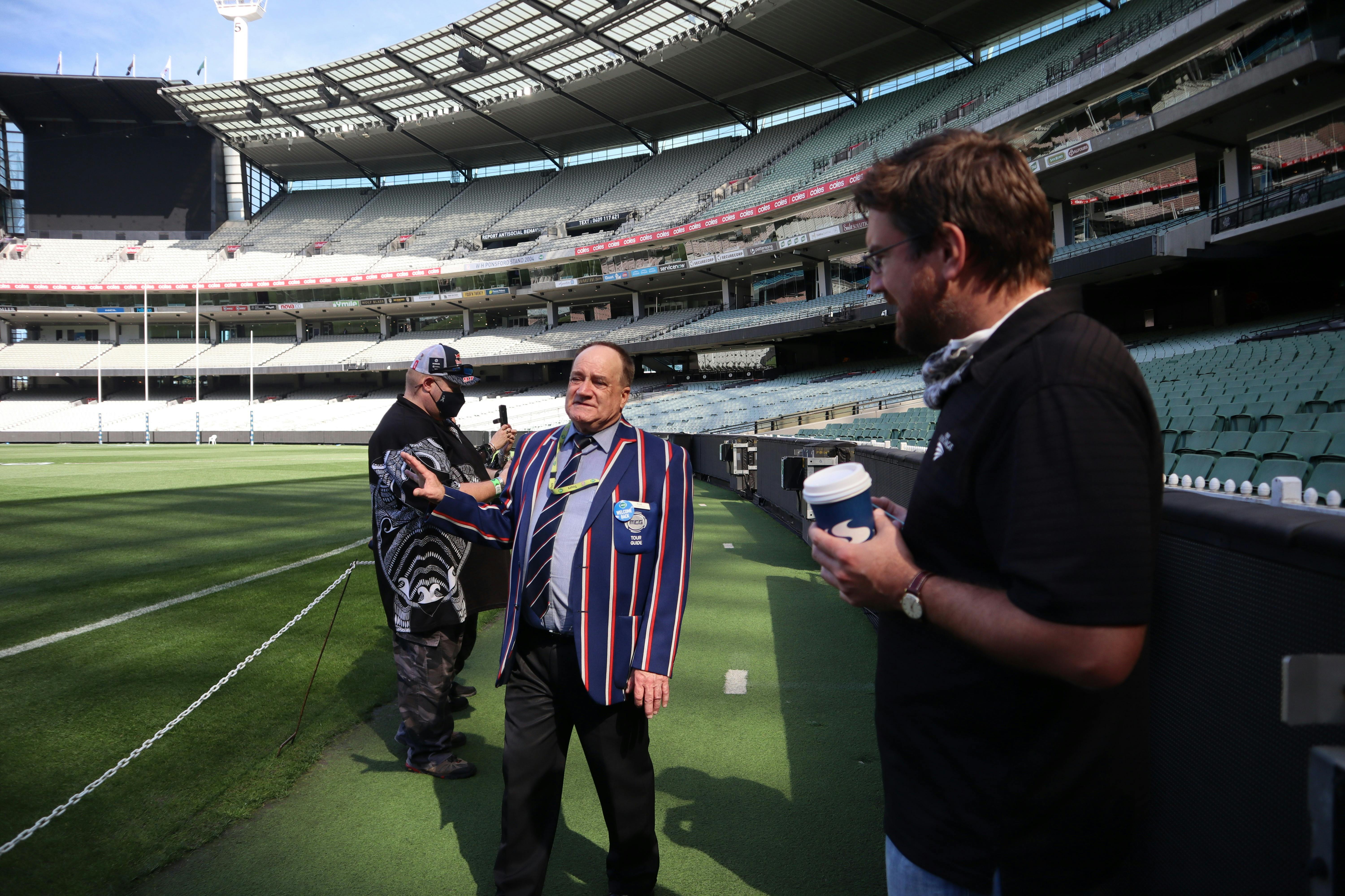 MCG Tour guide and guests on the MCG ground