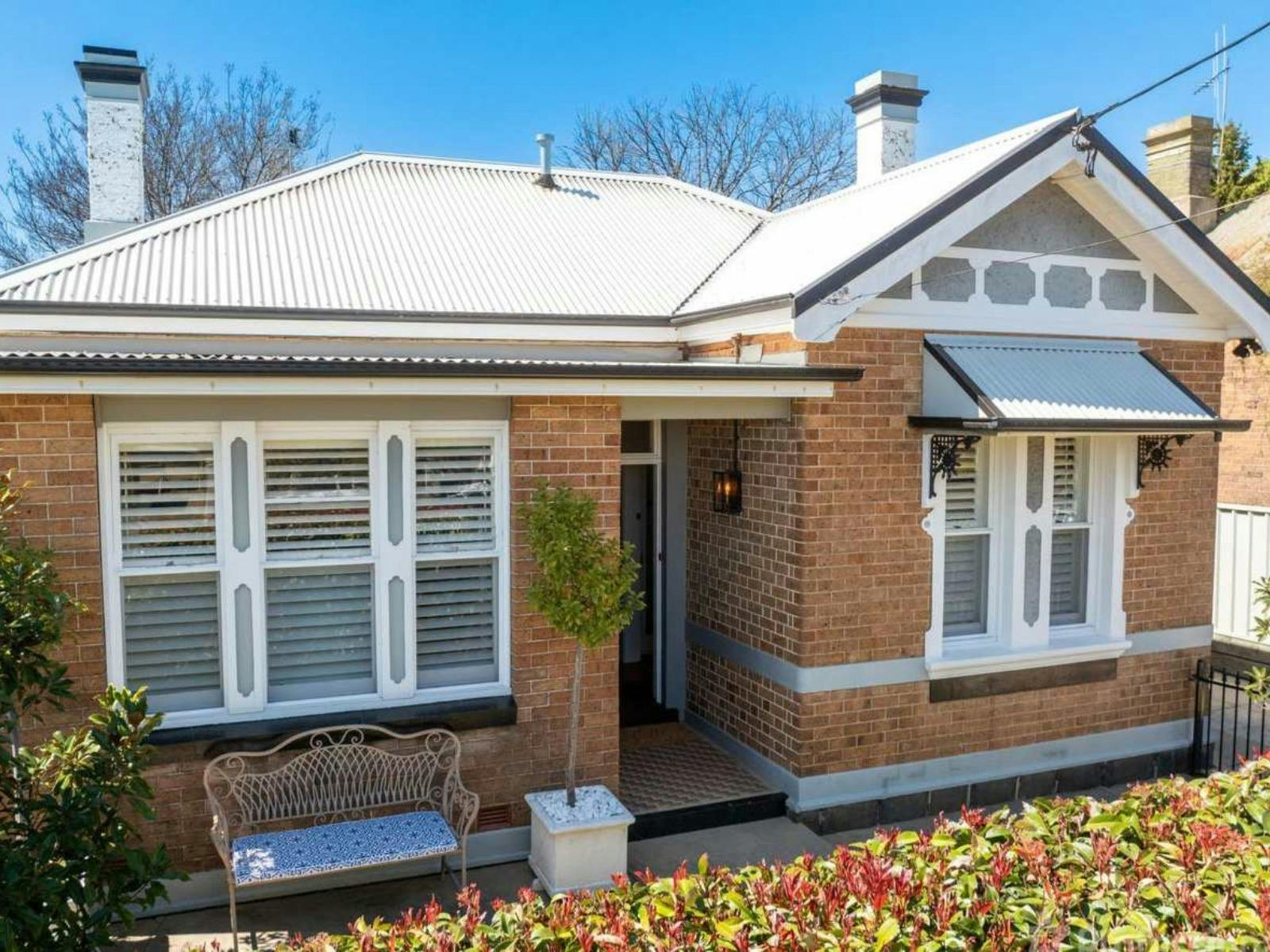 Brick home in Orange with lots of character and close to town to walk to local destinations.