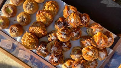 A tray of golden pastries from a birds eye view