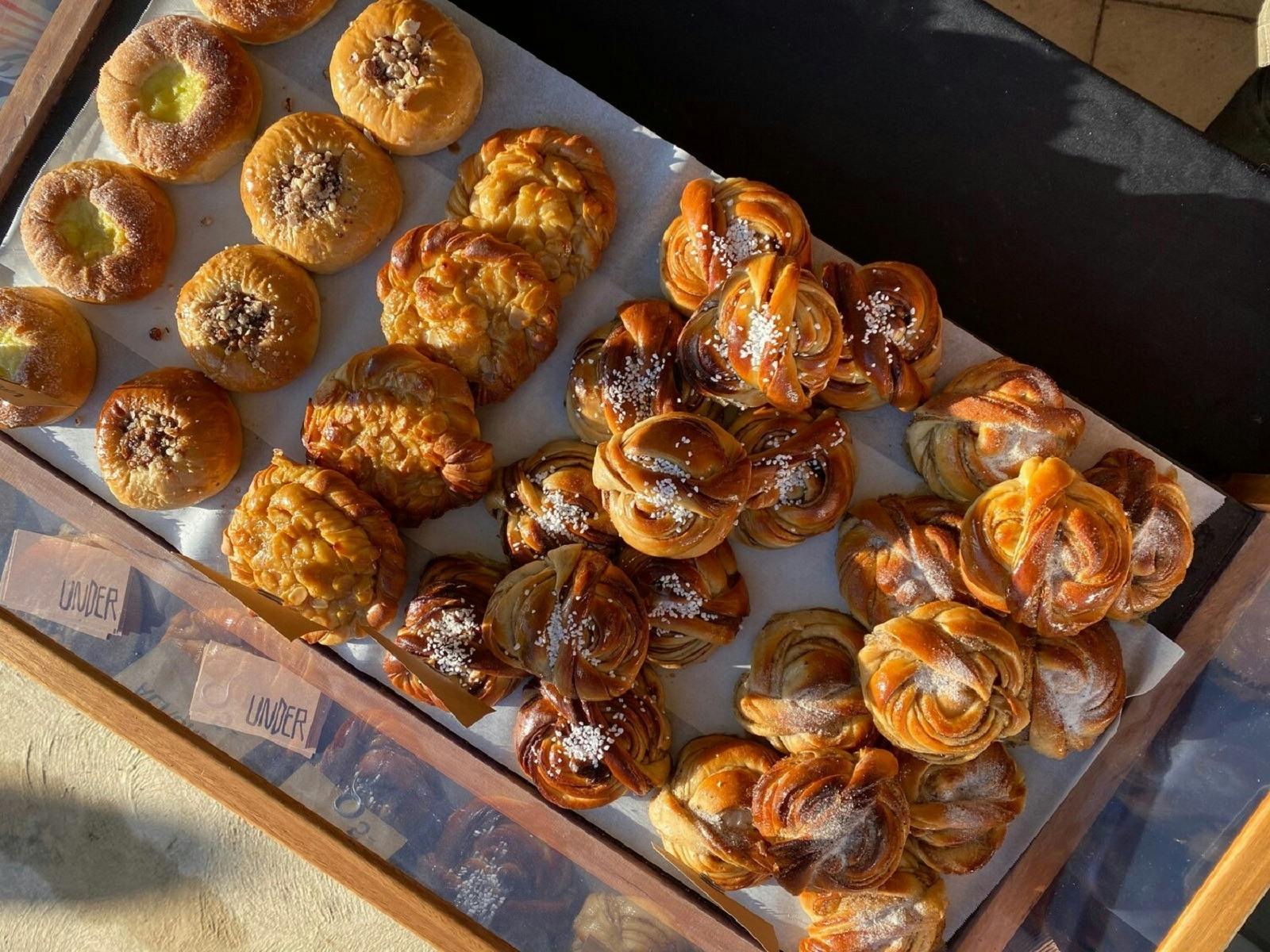 A tray of golden pastries from a birds eye view
