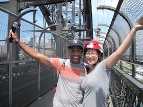 Couple riding on the Sydney Harbour Bridge