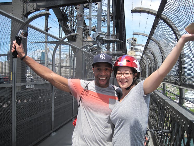 Couple riding on the Sydney Harbour Bridge