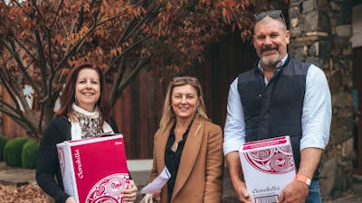 People holding boxes of wine at Clonakilla