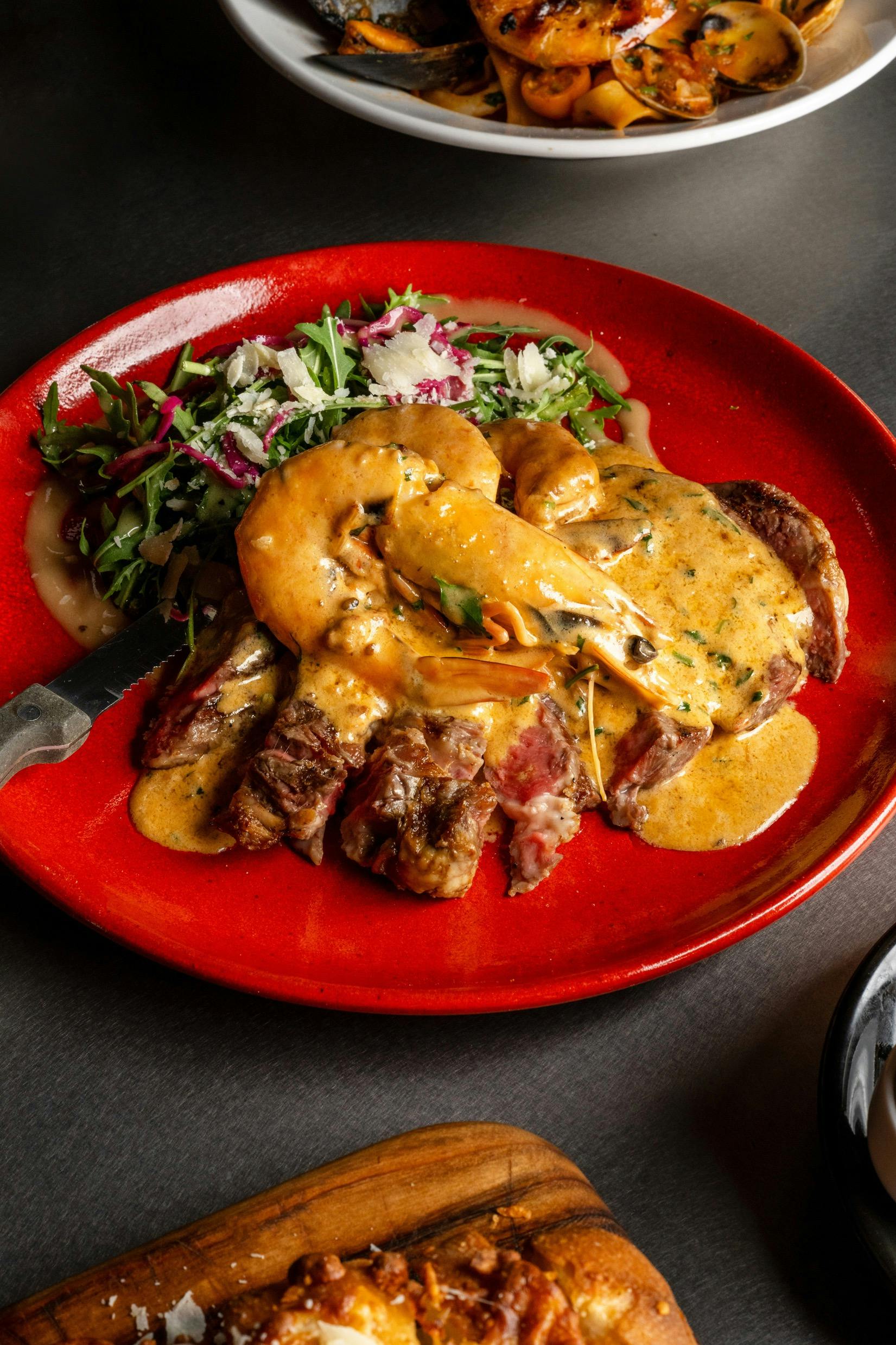 Scotch Fillet Surf and Turf with signature sauce