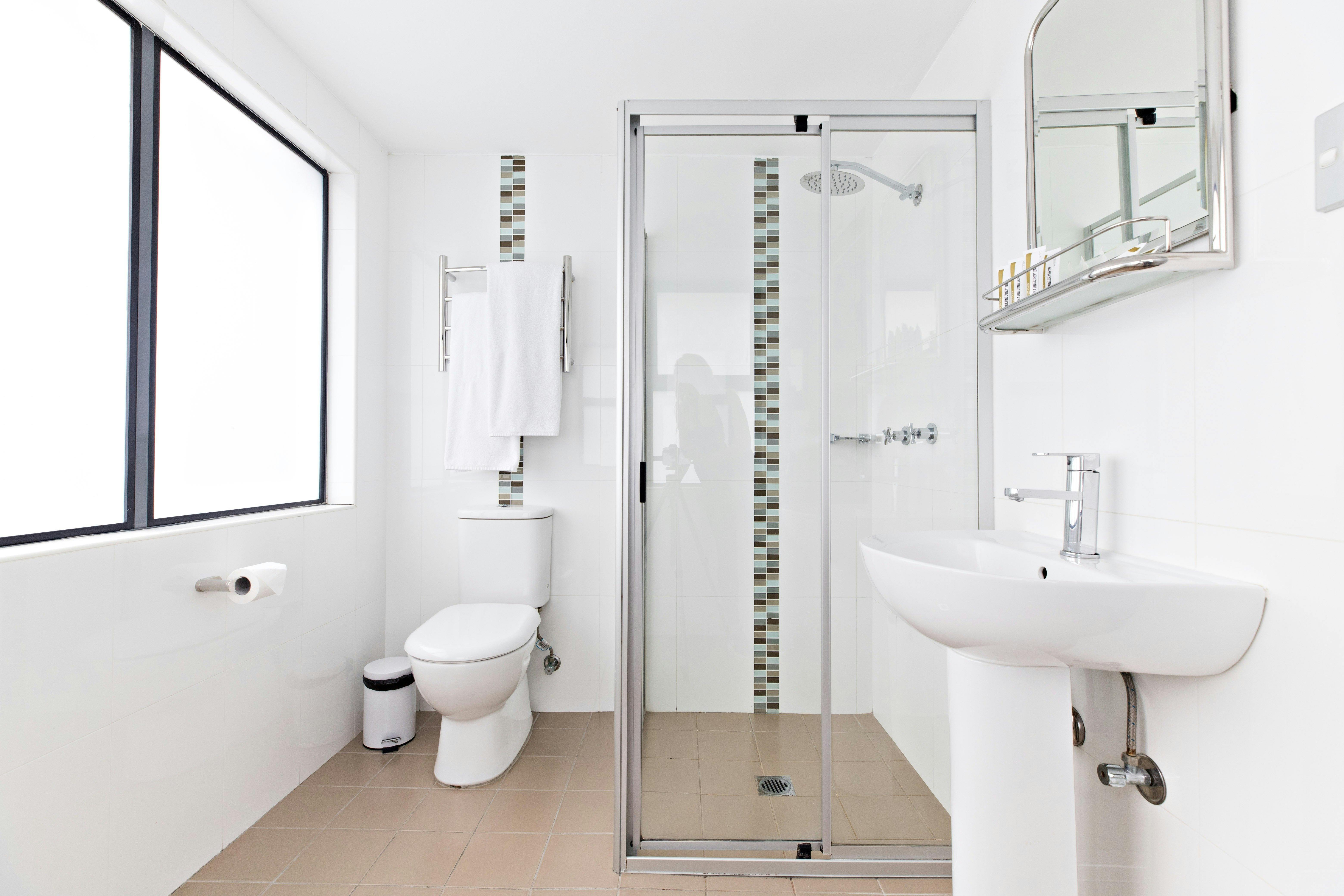 Bathroom large rooms with shower, sink and toilet