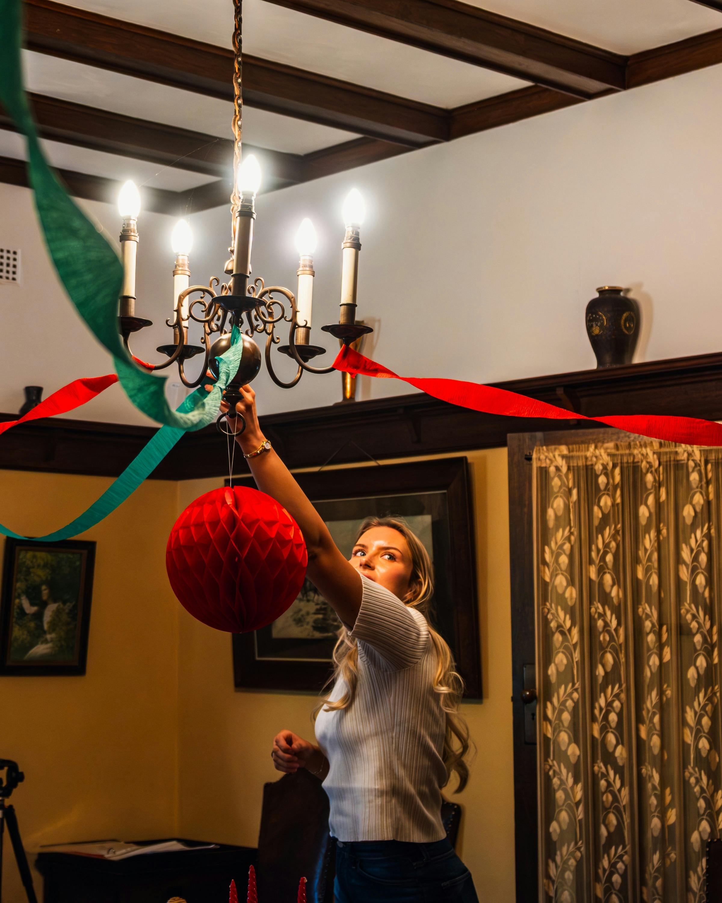 Ornaments being hung at Calthorpes House by curator