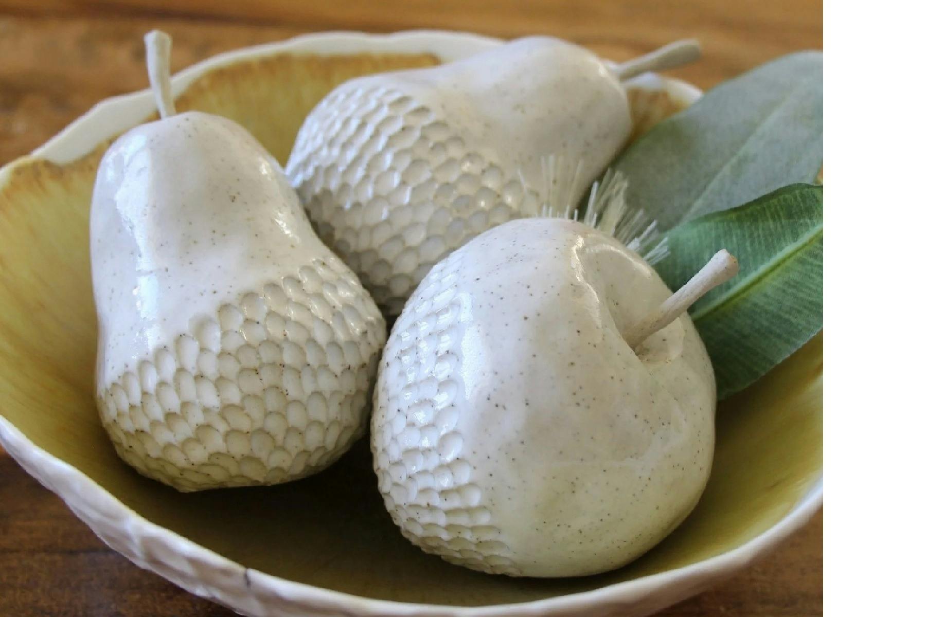 Ceramic pears and apples in a bowl