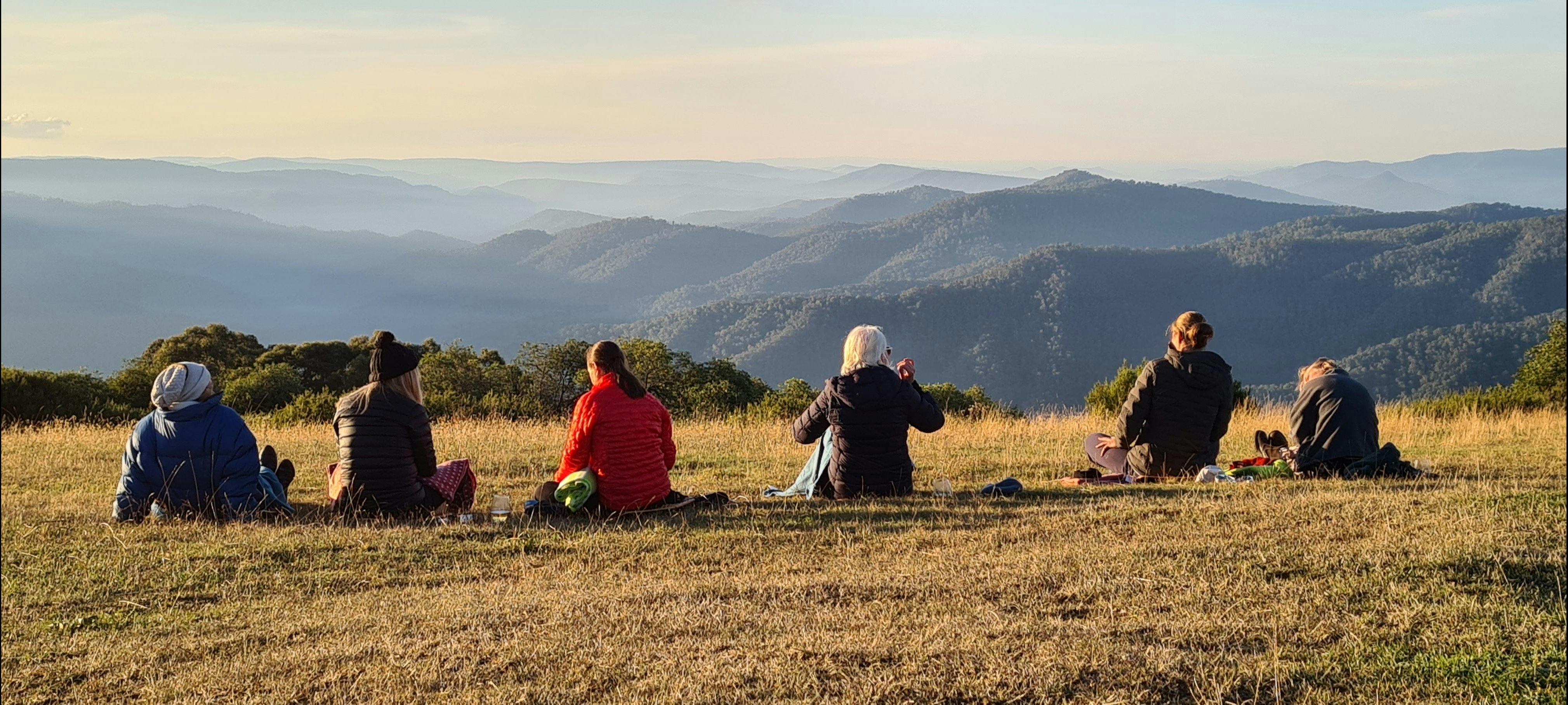 A group of hikers enjoying the views at Craig's Hut.