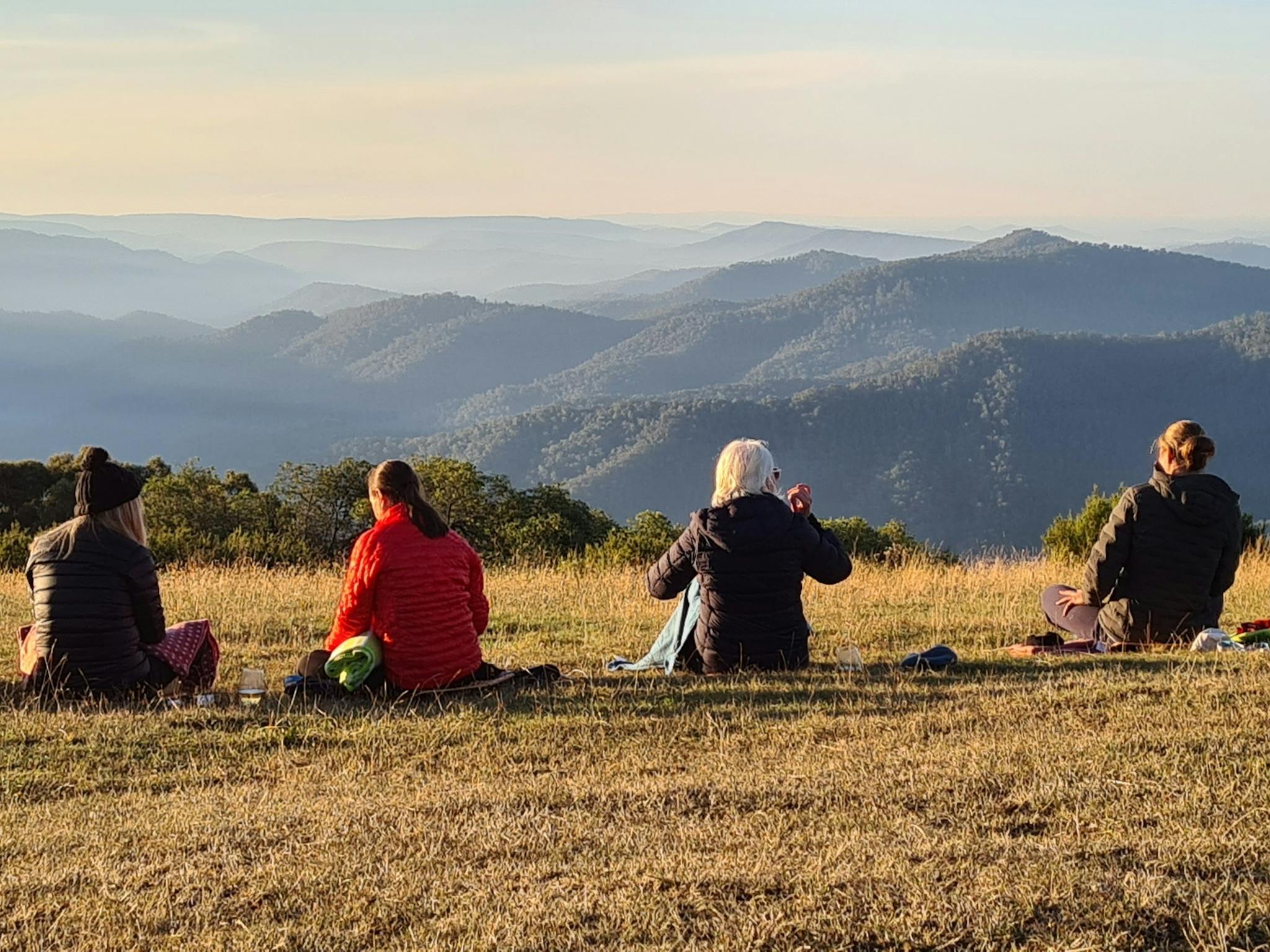 A group of hikers enjoying the views at Craig's Hut.
