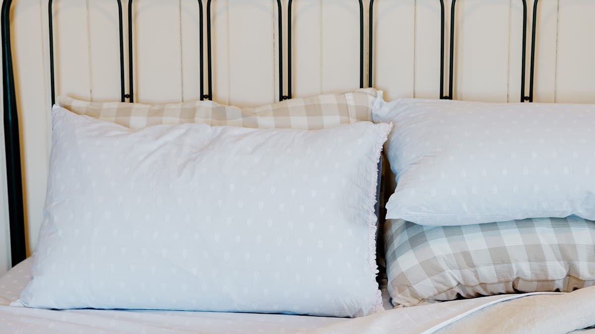 Styled photo of an inviting bed with luxurious linen