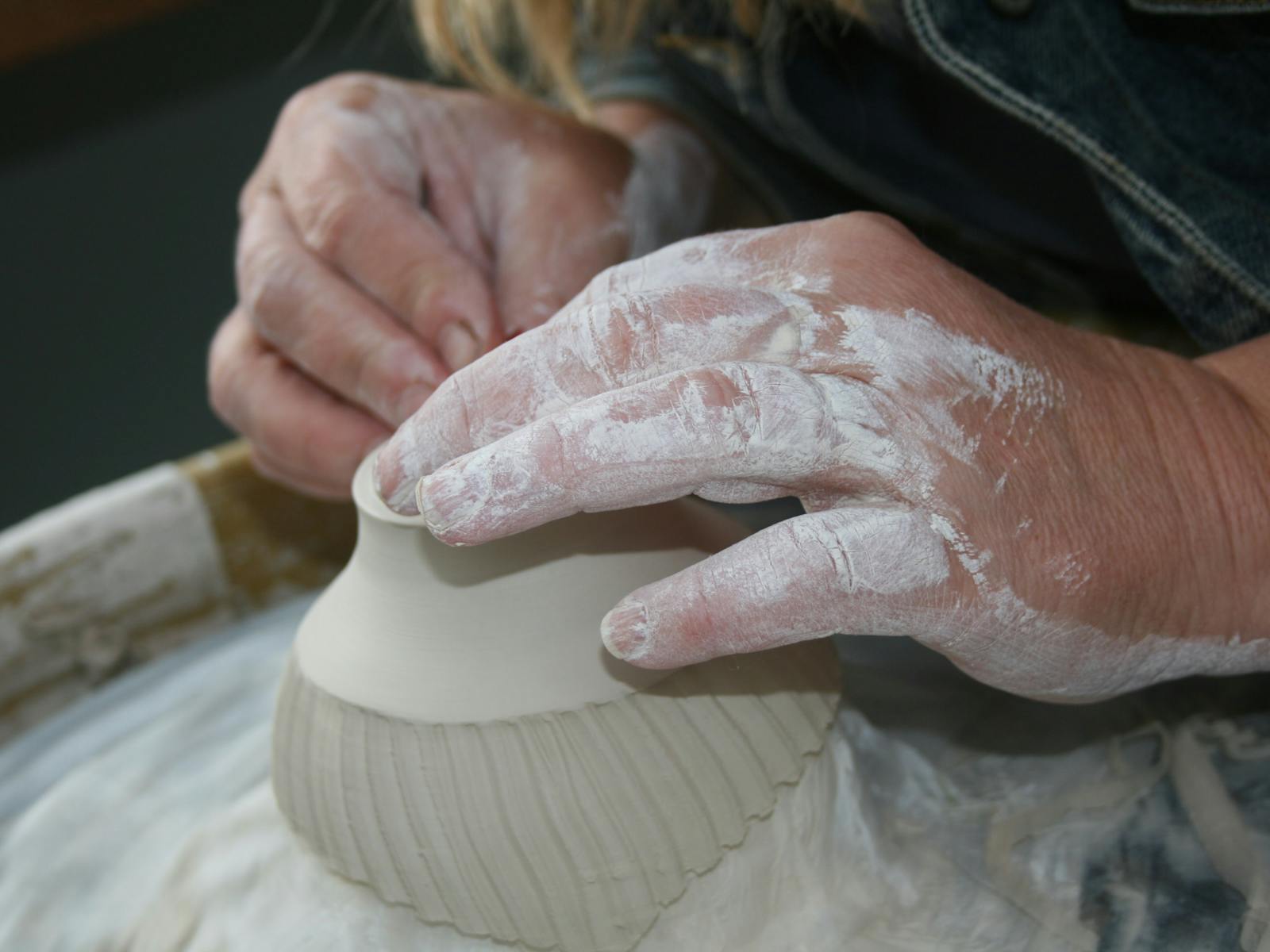 Lisa Britzmans hands at work on the pottery wheel in the Campo de Flori Ceramic studio in Glen Huon