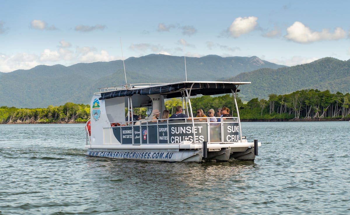 River Cruise Boat with a group relaxing and taking in the site of Tropical North Queensland