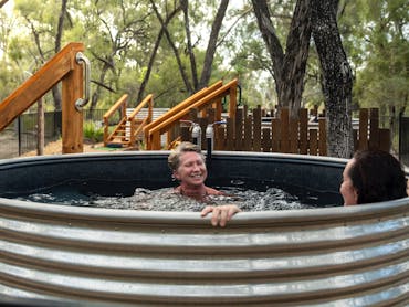Guests enjoying a Private Soak Pool at Talaroo Guests enjoying a Private Soak Pool at Talaroo
