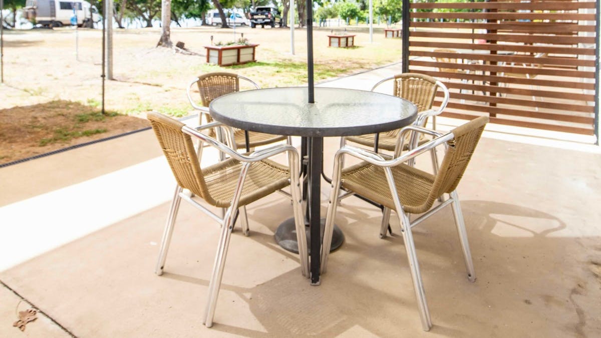 Outdoor seating for ground floor rooms at Dingo Beach Hotel