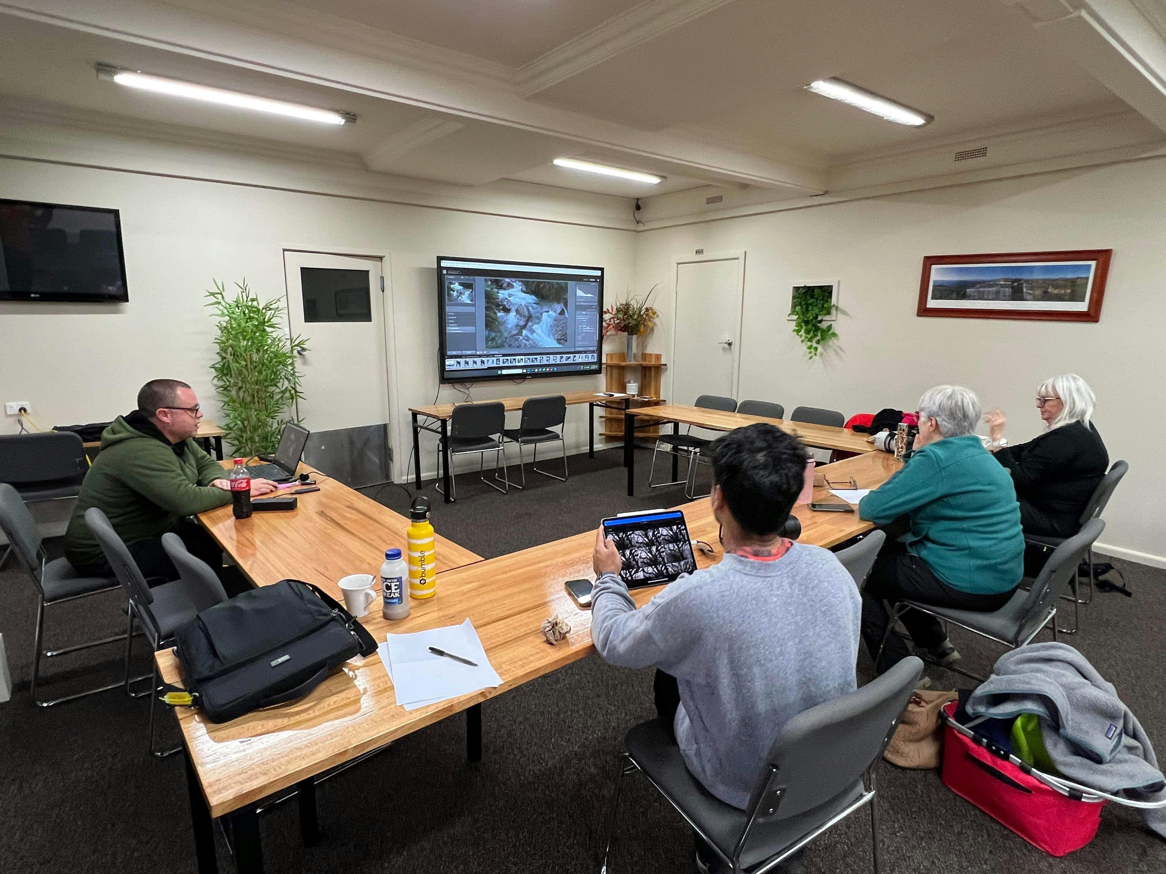 Workshop participants learning to edit their photos.