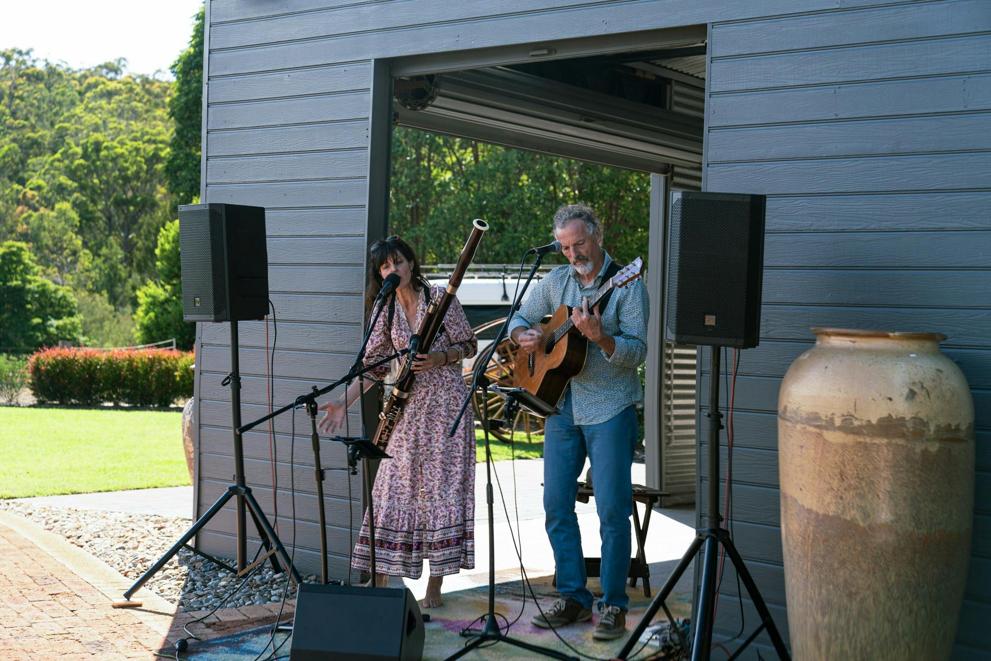Two musicians playing instruments live during an event at The Nursery venue space.