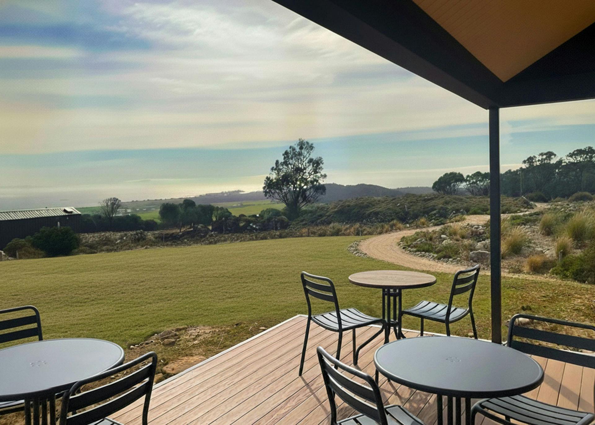 Relax at the café at The George Tasmania Eco-Pod Accommodation with ocean views