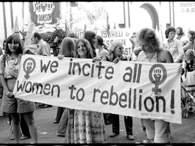 A black and white photograph from 1975 of a women's rights protest