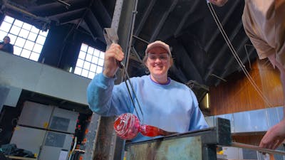 Participant in glassblowing class