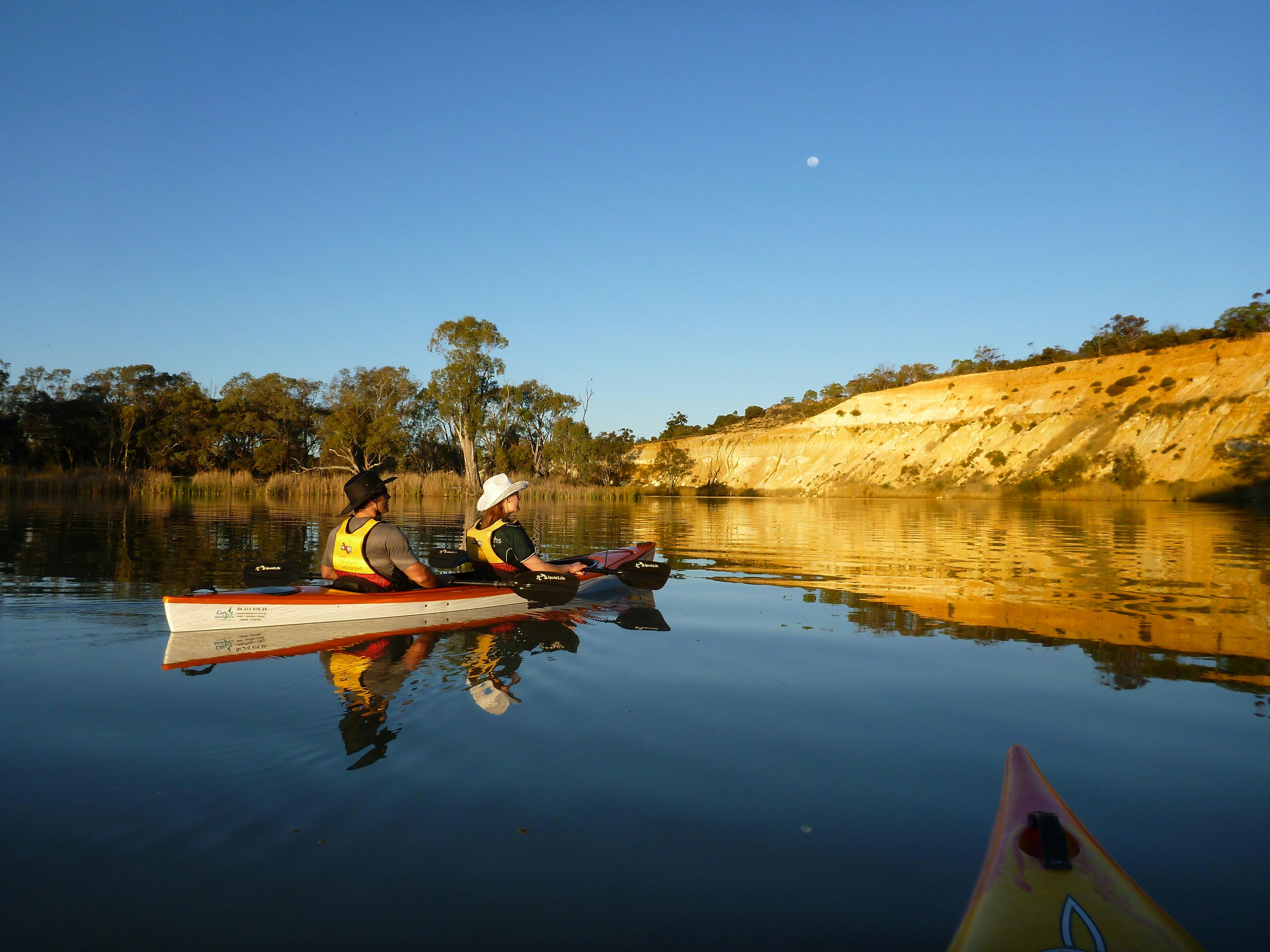kayak near folden cliffs, amidst beautiful reflections