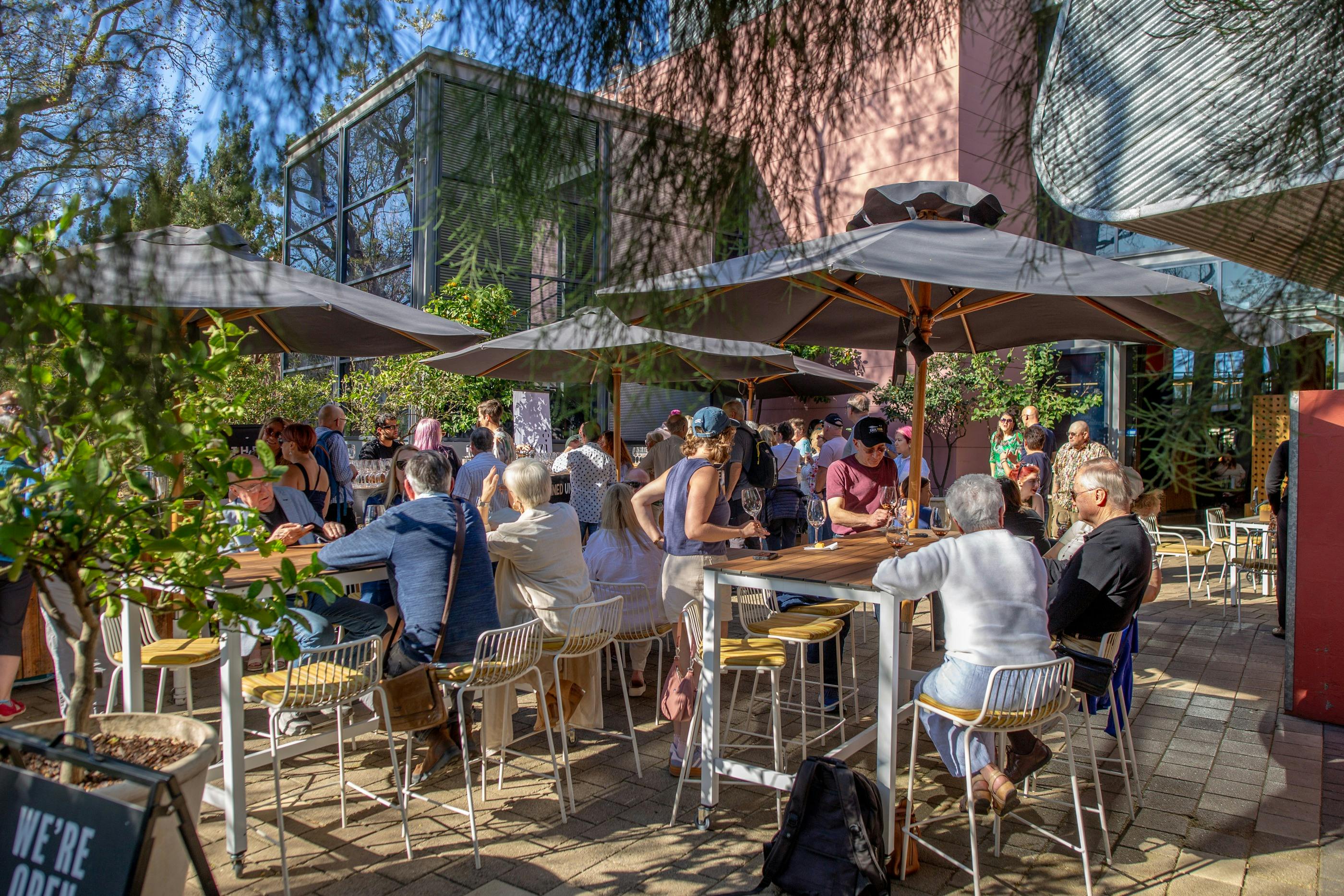 Guests enjoying an event outdoors on a terrace