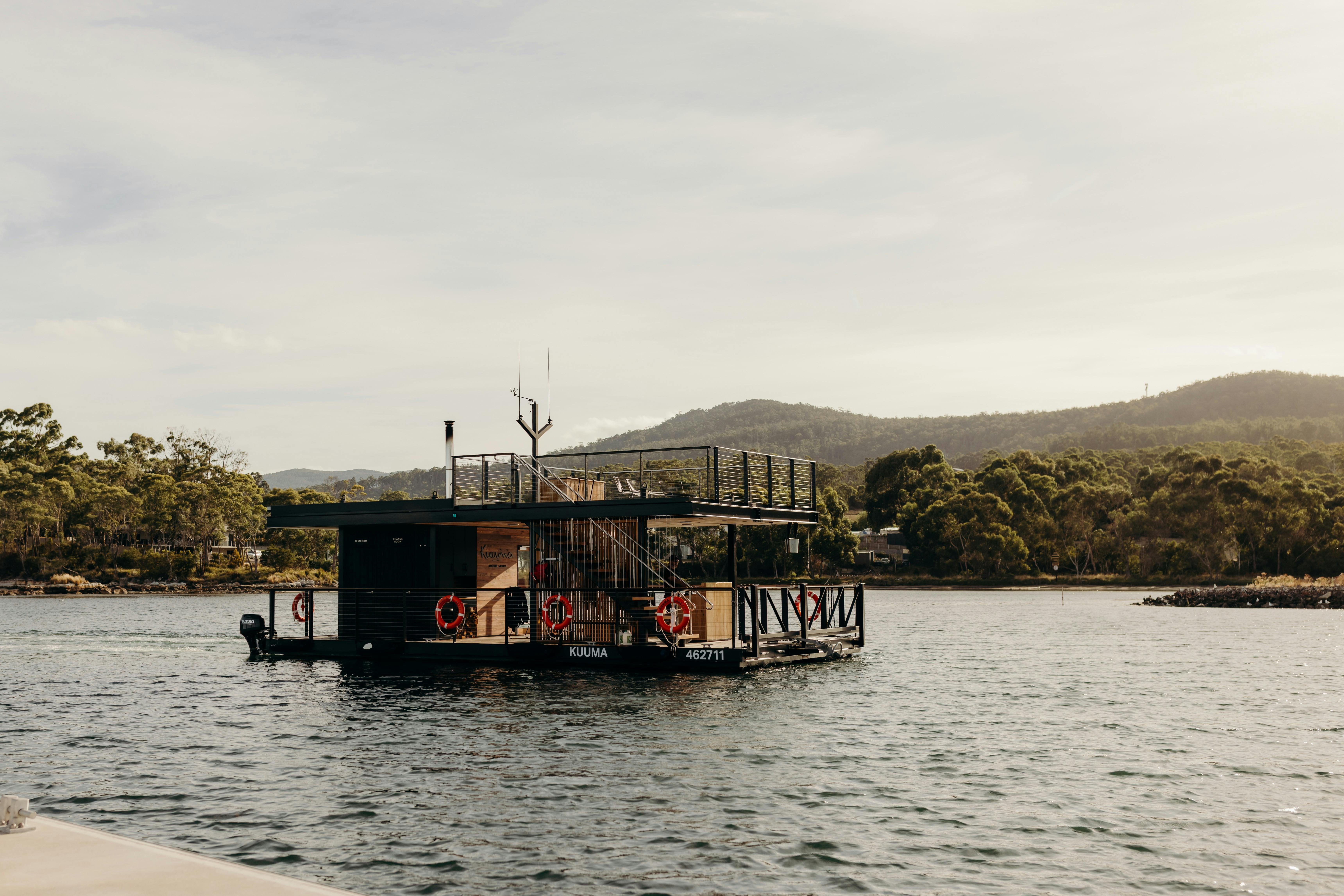 Kuuma Sauna Pontoon Boat cruising in Southern Tasmania