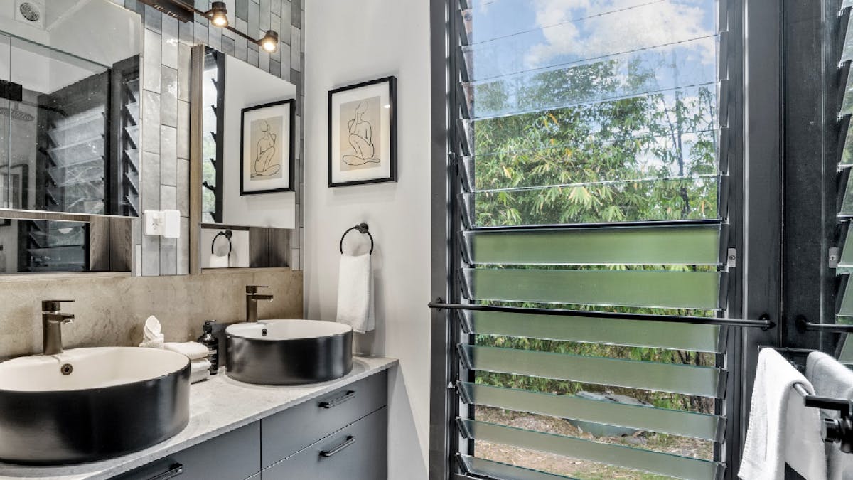 Shared bathroom with shower and separate toilet