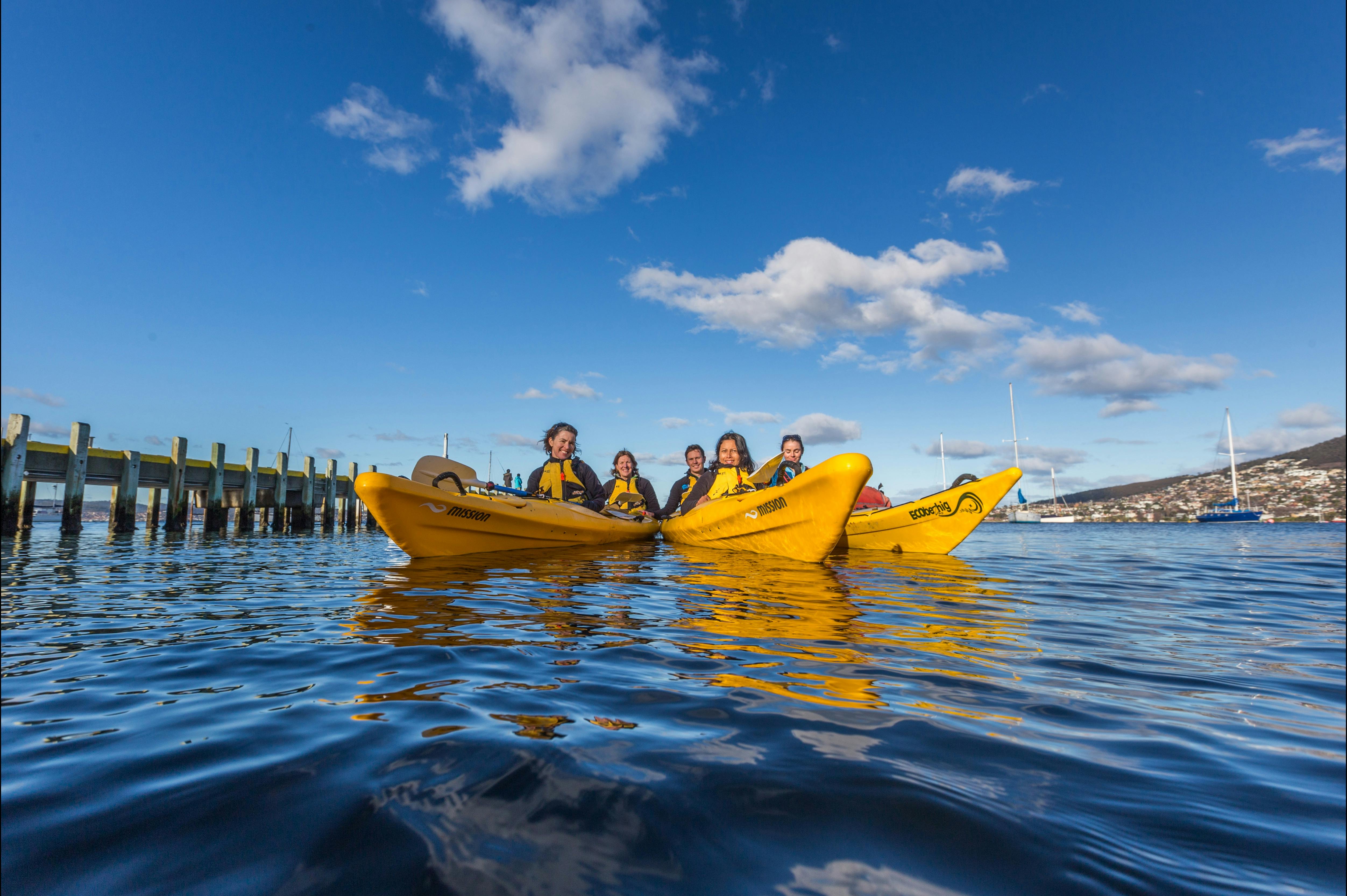 Kayakers enjoying calm conditions on the Hobart Waterfront