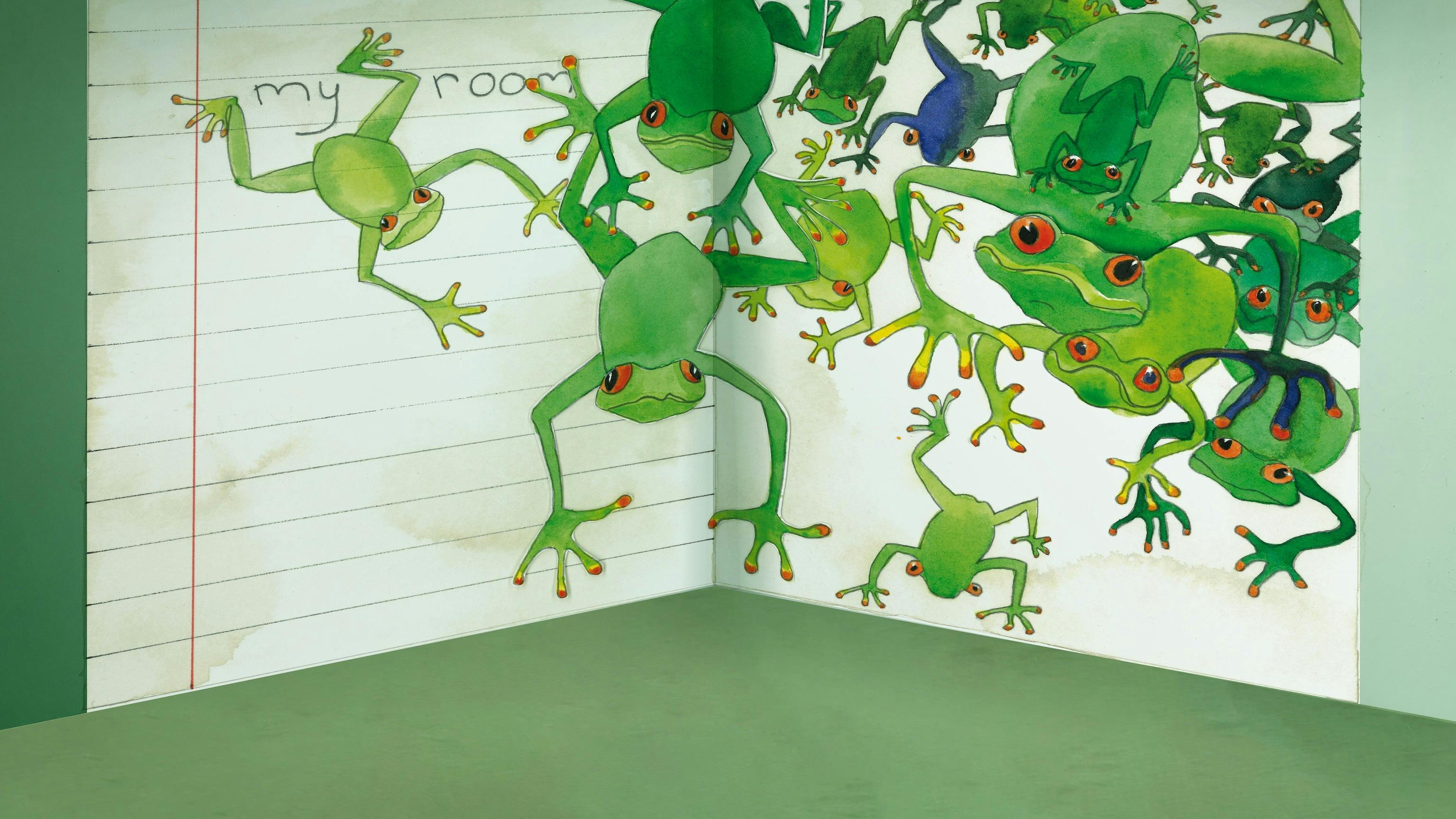 a wall notebook with cartoon frogs coming off the page