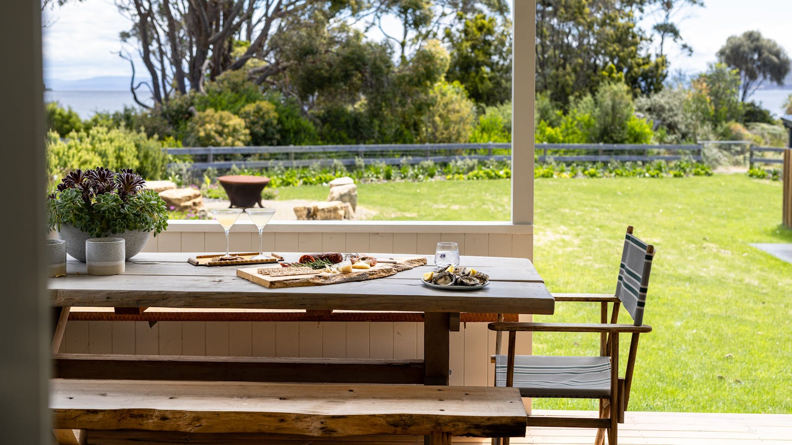 Back deck with views across to White Beach and firepit