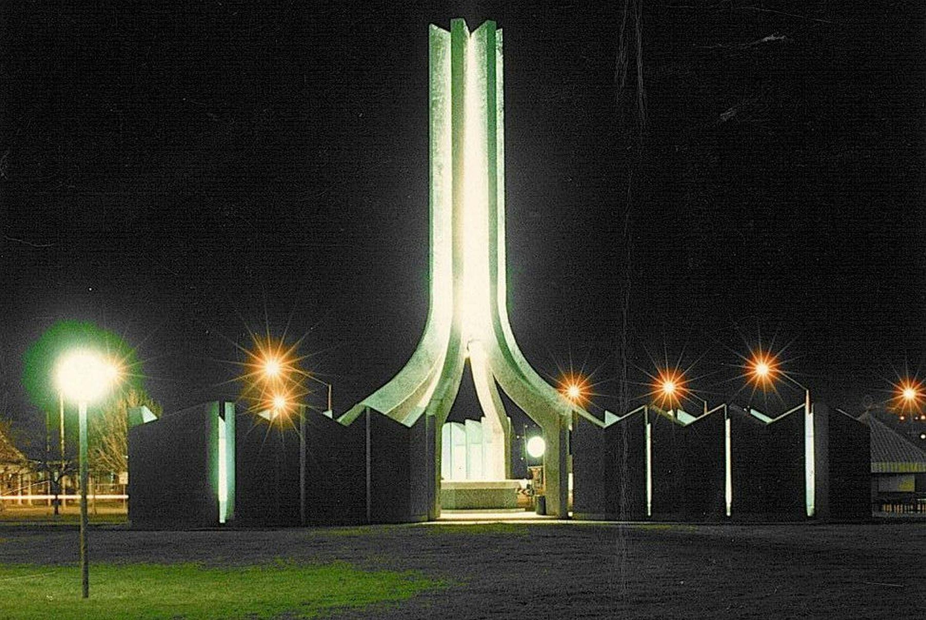 Two courthouses of the Bicentenial Memorial and the central spire lit up at night