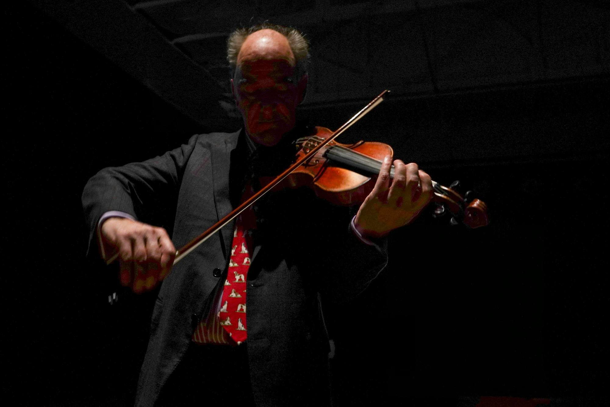 Violinist Peter Tanfield plays a violin