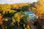 Overhead view of guesthouse, trees