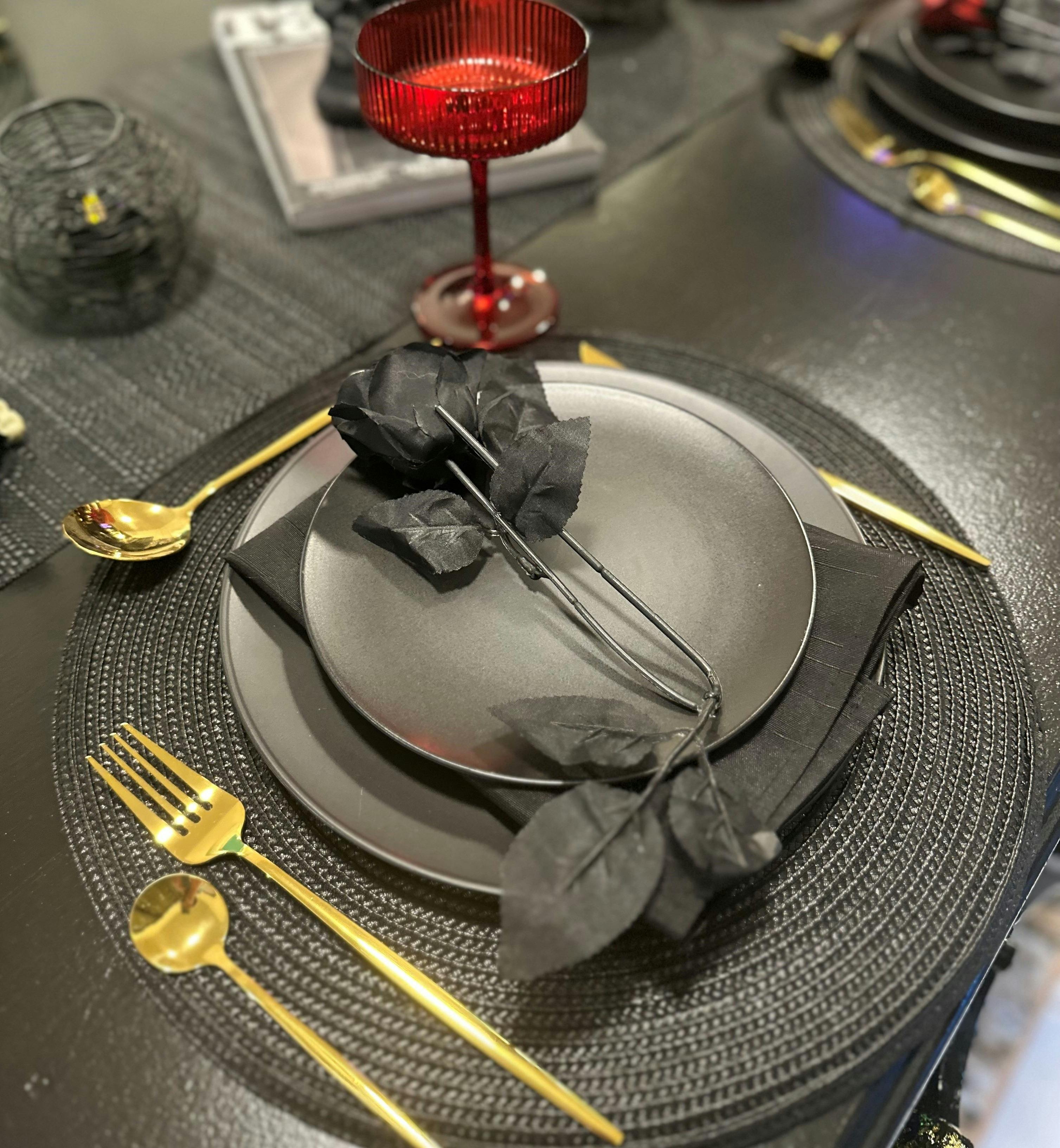Beautiful dining setting with a black rose
