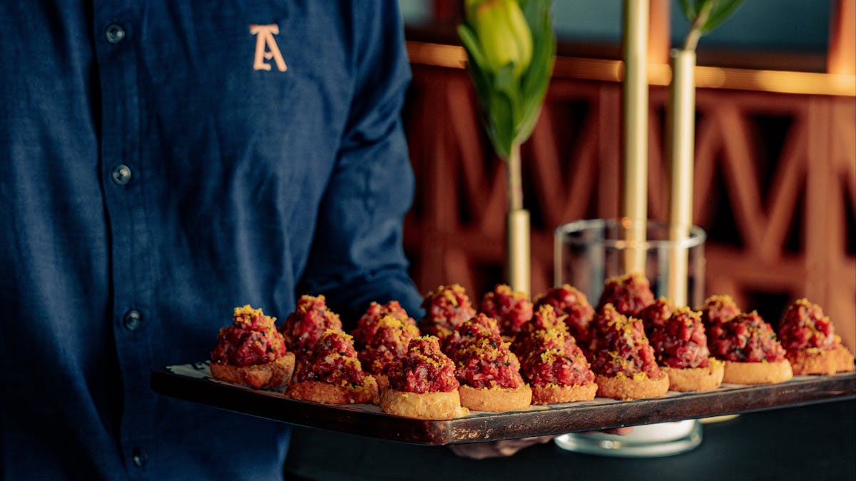 spicy tuna on crispy rice on a canapé board for events