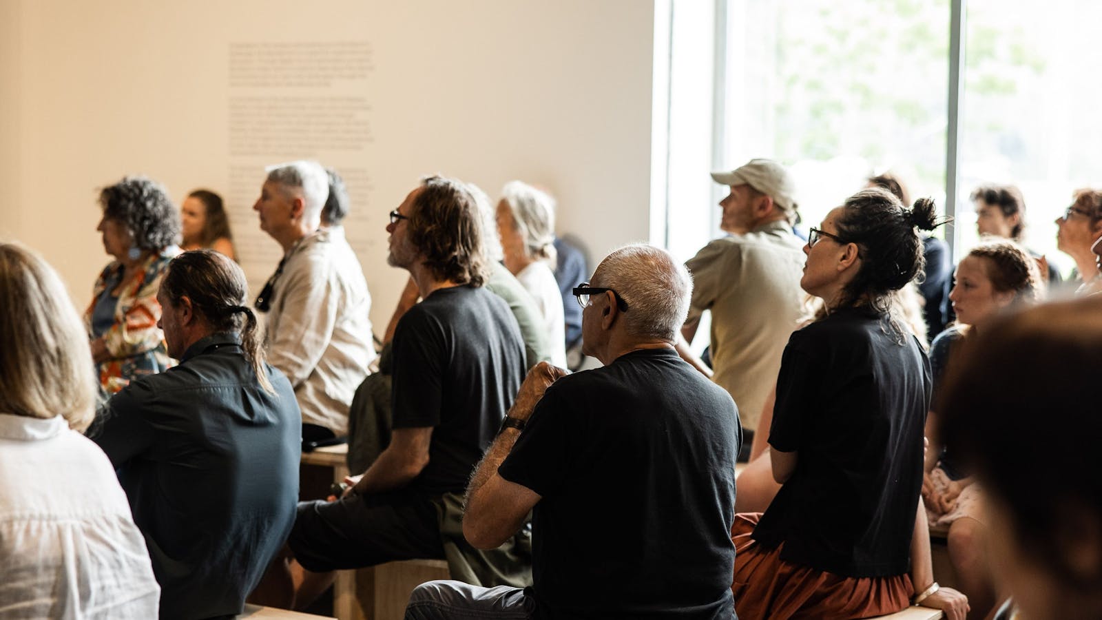 Visitors engaging with a talk in the Art Museum