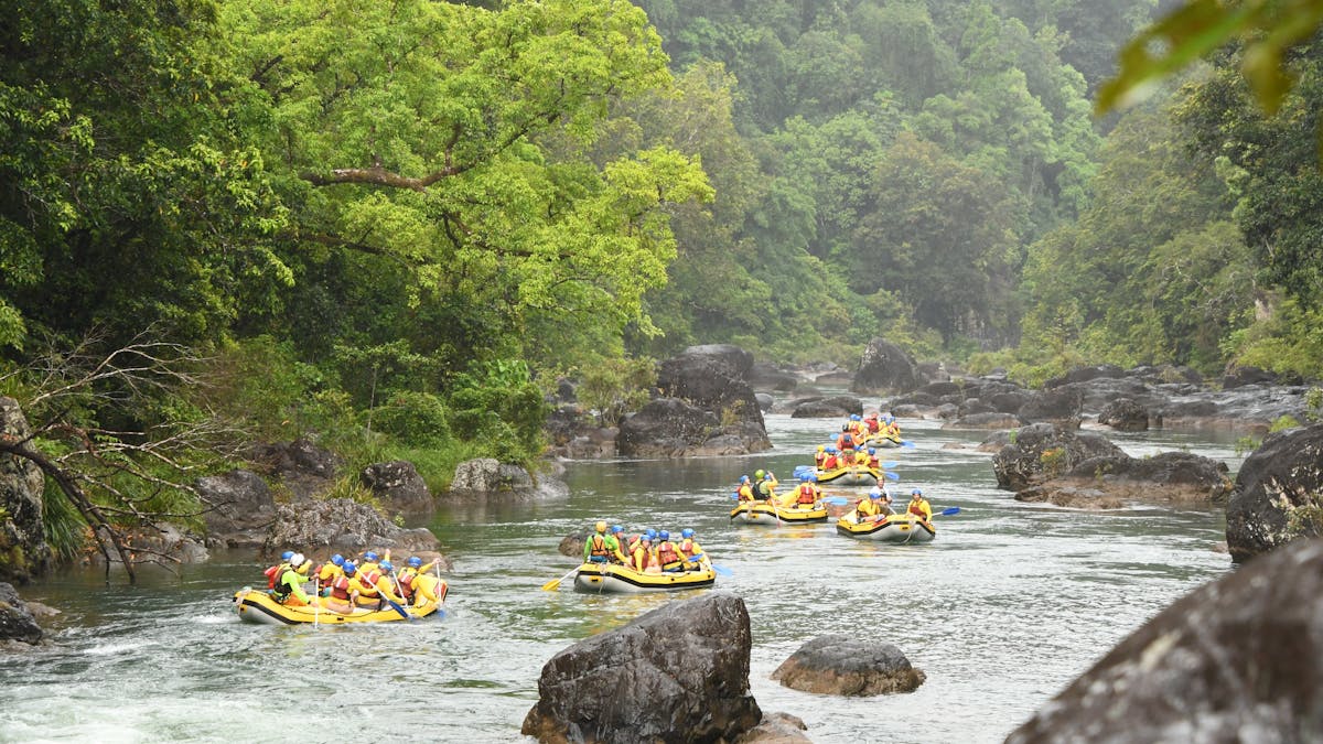 Scenic Shot of multiple rafts going down the Tully river in Tropical North Queensland