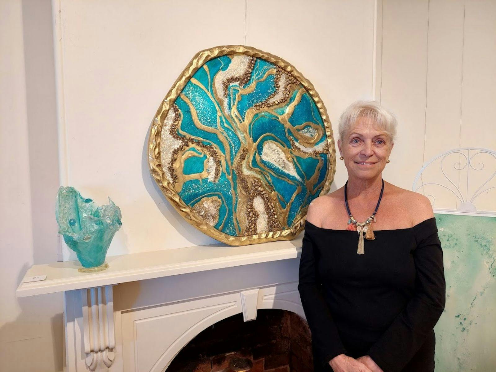 Beatrice with her resin circular Egyptian Geode, using her favorite color turquoise.