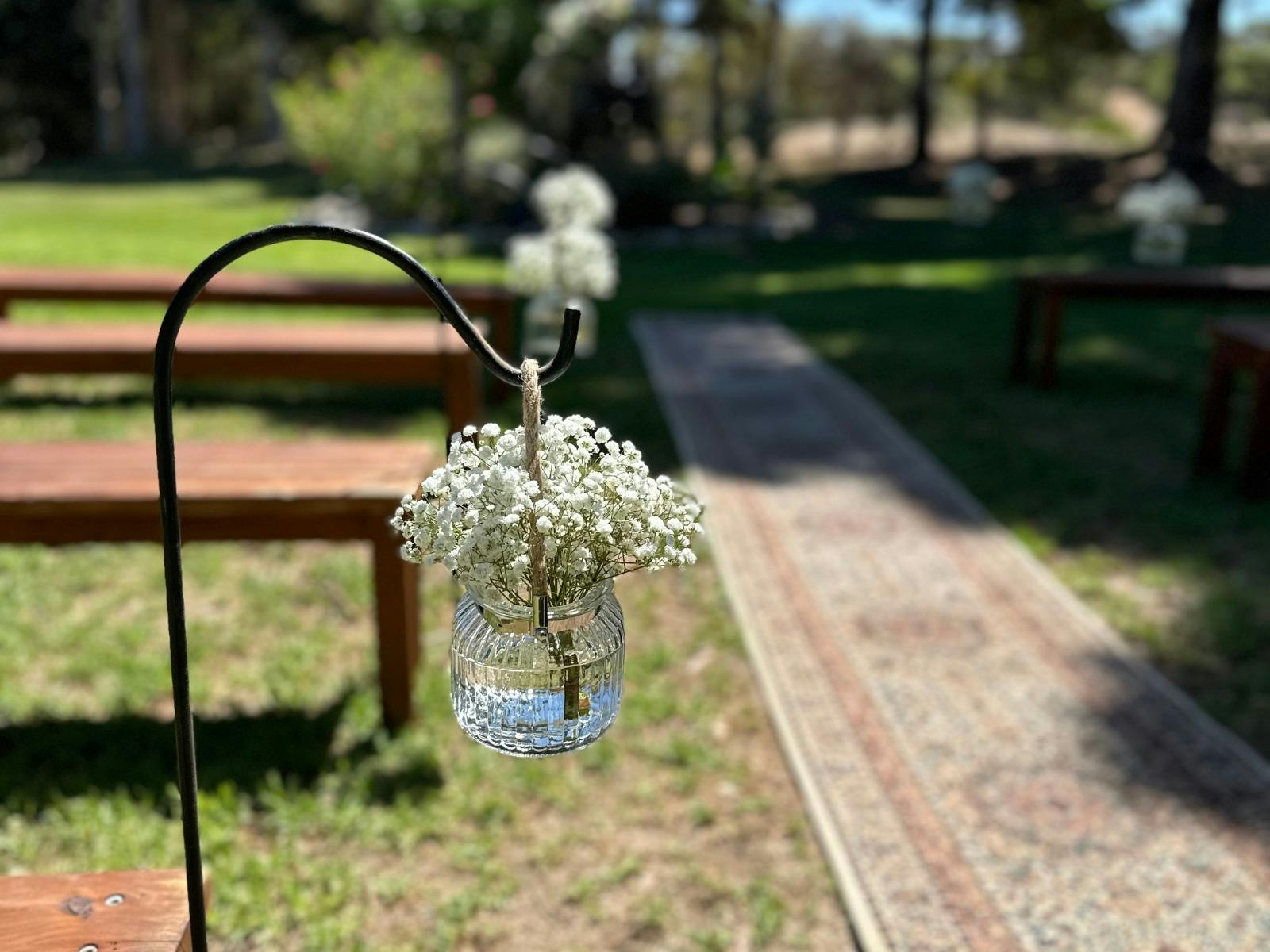 Hired Timber Benches, Runner & Shepherd Hooks with Babys Breath