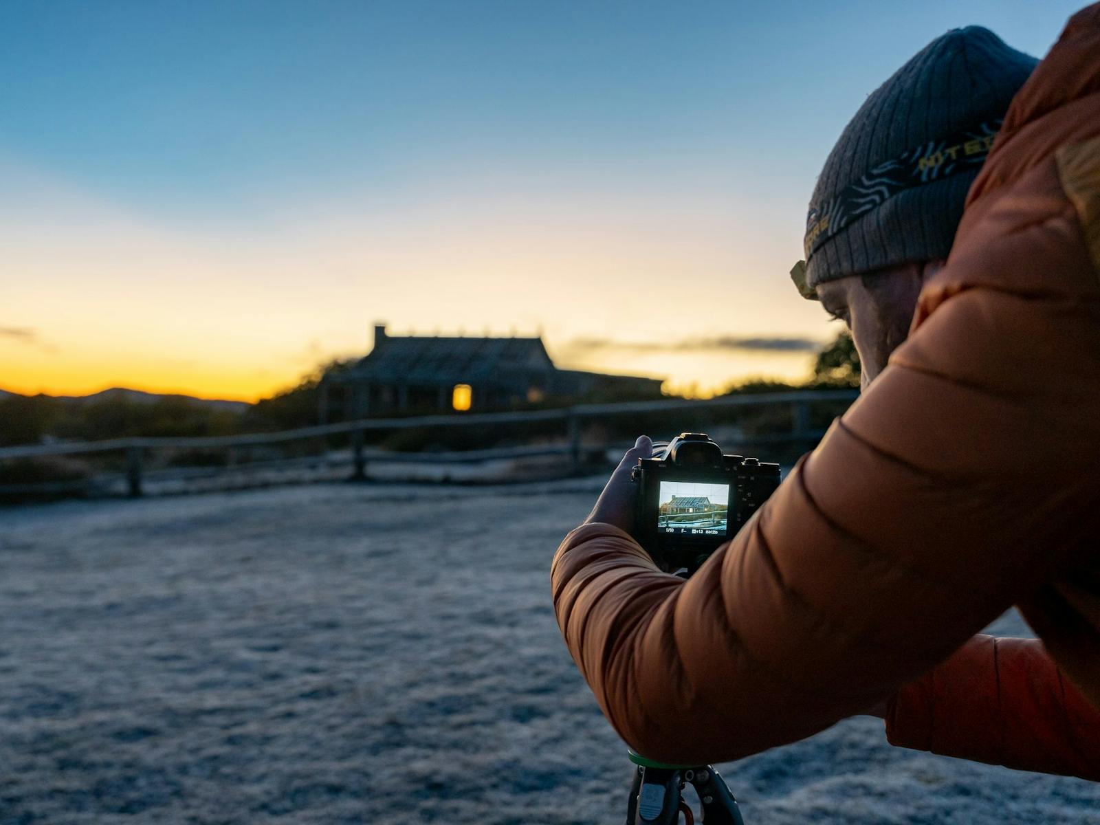 A photography workshop is taking place on a frosty morning at Craig's Hut.
