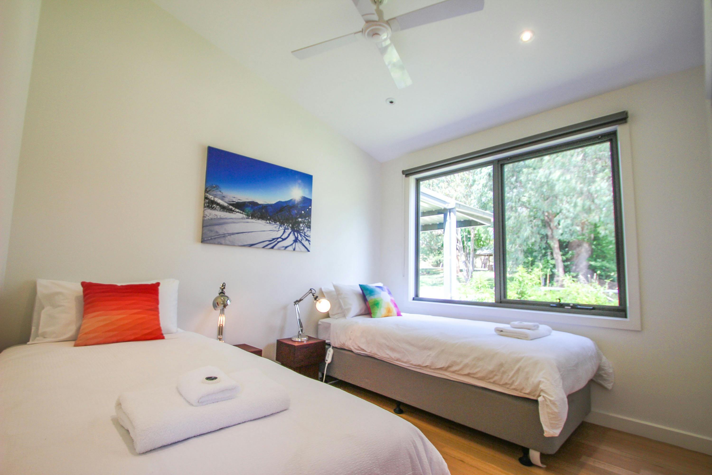 Singles bedroom with wardrobe and garden views