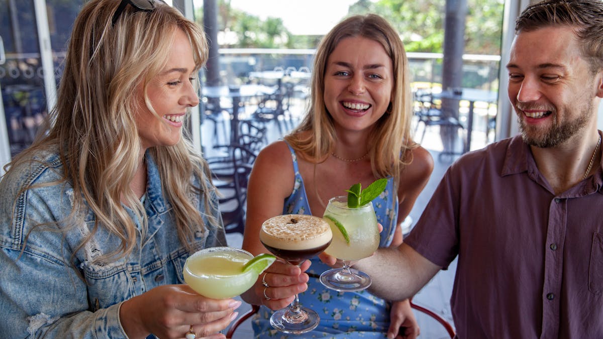 Three great friends enjoying a cocktail at Coolum Surf Club