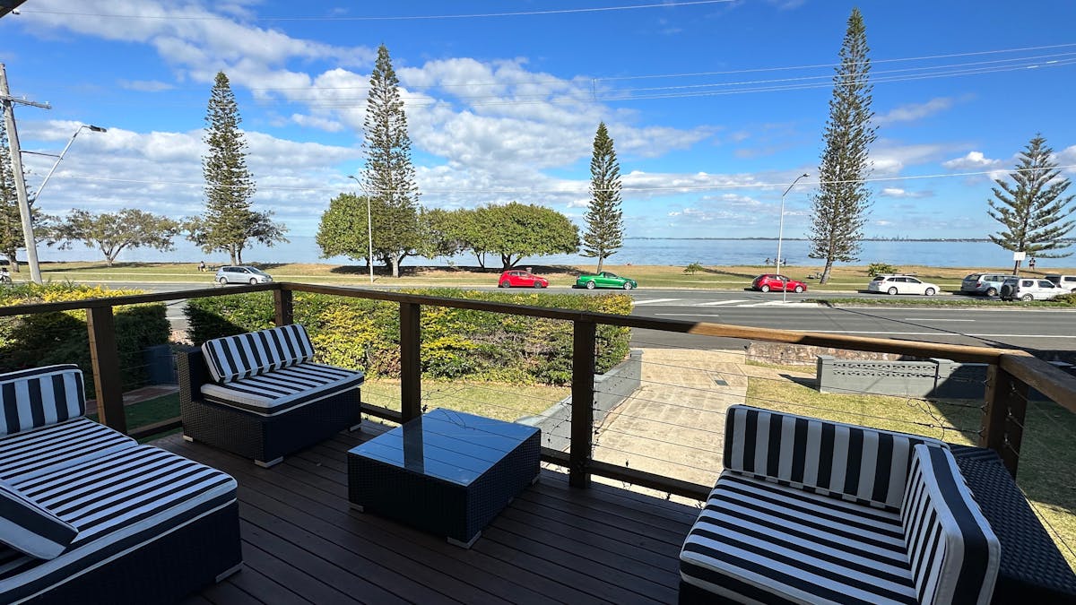 Comfortable outdoor lounge on the balcony. Sit back and soak in the ocean and city views!