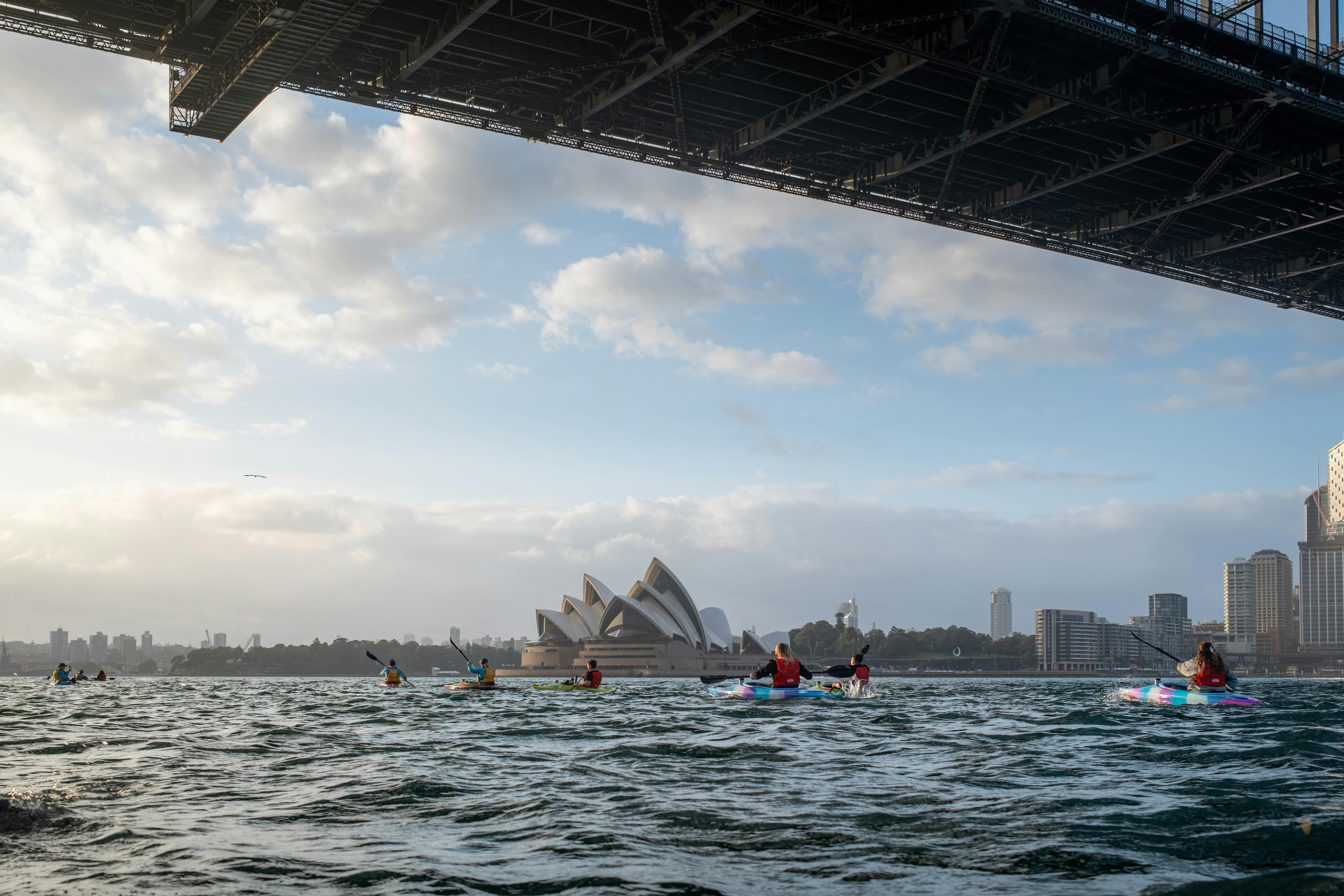 Sydney By Kayak leads customers safely under the Sydney Harbour bridge, to see the Opera House.