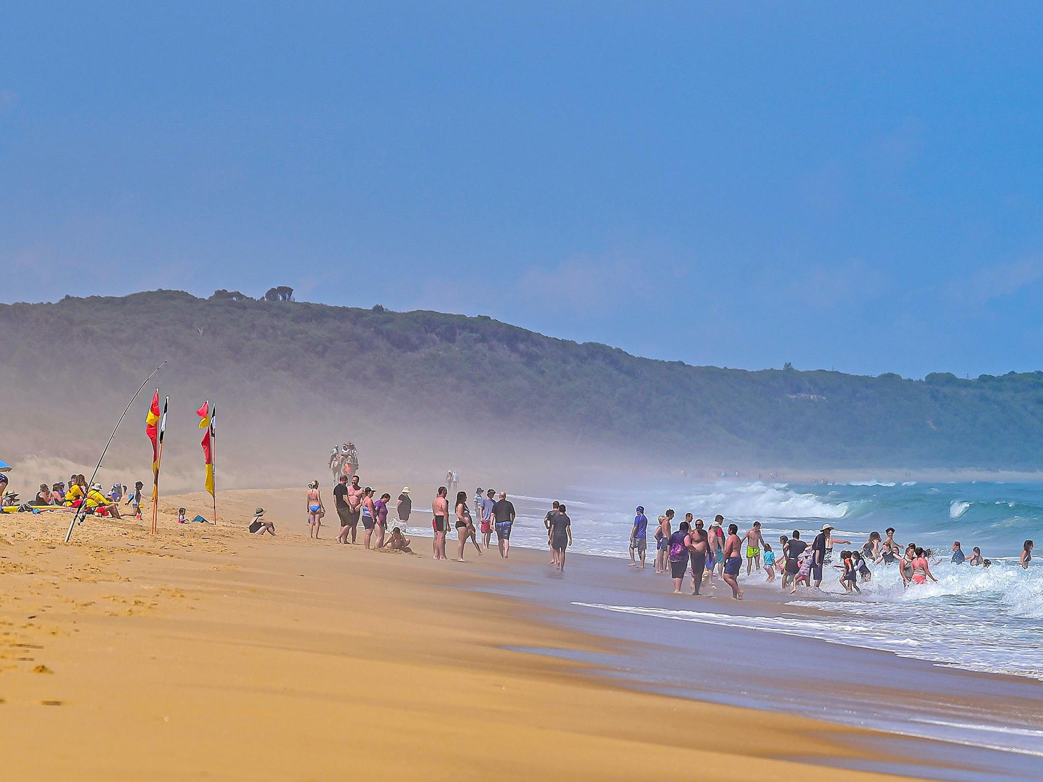 There are endless beaches to be explored around Lakes Entrance. Camel rides can be seen in the back.