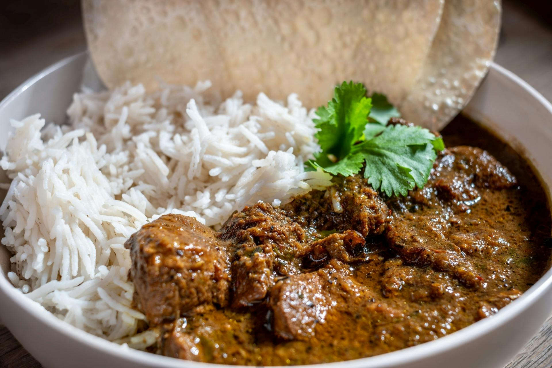 Lamb curry with rice and bread